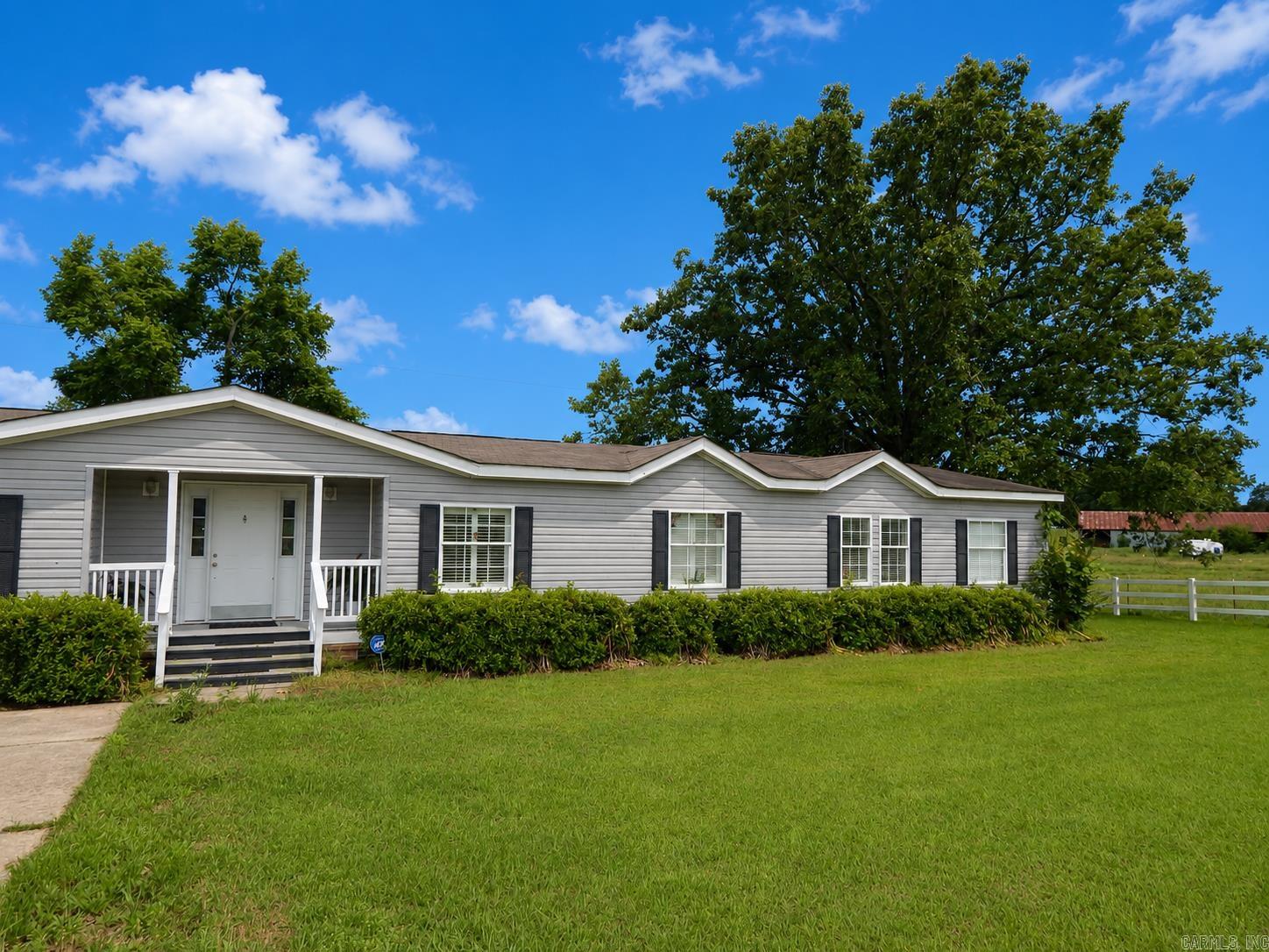 Country living without all the upkeep! Located just outside of Quitman, this beautiful home offers peaceful surroundings with large mature trees and a great location between Heber Springs and Conway. Enjoy being close to Greers Ferry Lake and the Little Red River for fishing, boating, and outdoor fun.  Inside, you’ll love the natural light pouring through the large windows accented with beautiful plantation shutters. The cozy fireplace with electric logs creates a warm and inviting living space. The kitchen features stainless steel appliances, and the home offers spacious walk-in closets for plenty of storage.  Perfect for anyone looking for peaceful country living with convenient access to shopping, dining, and recreation!