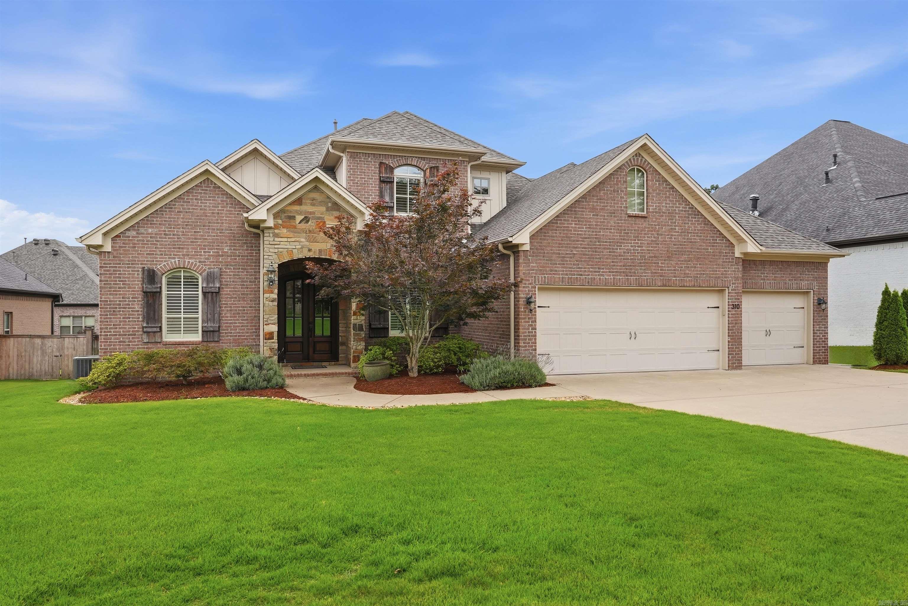 Tucked within the quiet, sought-after Miramar Place neighborhood of Chenal Valley, this well-maintained home offers an exceptional blend of location, comfort, and quality construction. Golf cart path access to Chenal Country Club is just steps away, with premier shopping and dining in West Little Rock minutes from your door. A classic brick and stone exterior opens into a two-story foyer with site-finished oak hardwood floors. The great room features custom built-ins, a gas-log fireplace, and large windows overlooking the backyard. The kitchen is well equipped for everyday cooking including granite countertops, a gas cooktop, double wall ovens, walk-in pantry, and a large island with barstool seating. The main-level primary suite offers a coffered ceiling, en-suite bath, and walk-in closet. Upstairs, two bedrooms share a Jack and Jill bath, a fourth bedroom suite includes a private bath, and a bonus room provides flexible space for media or hobbies. Outside, a covered patio and fully fenced backyard offer privacy. Additional features: roof replaced in 2023, foam insulation, low-E windows, smart Trane thermostats, EV charger plug-in, and a three-car garage with insulated doors.