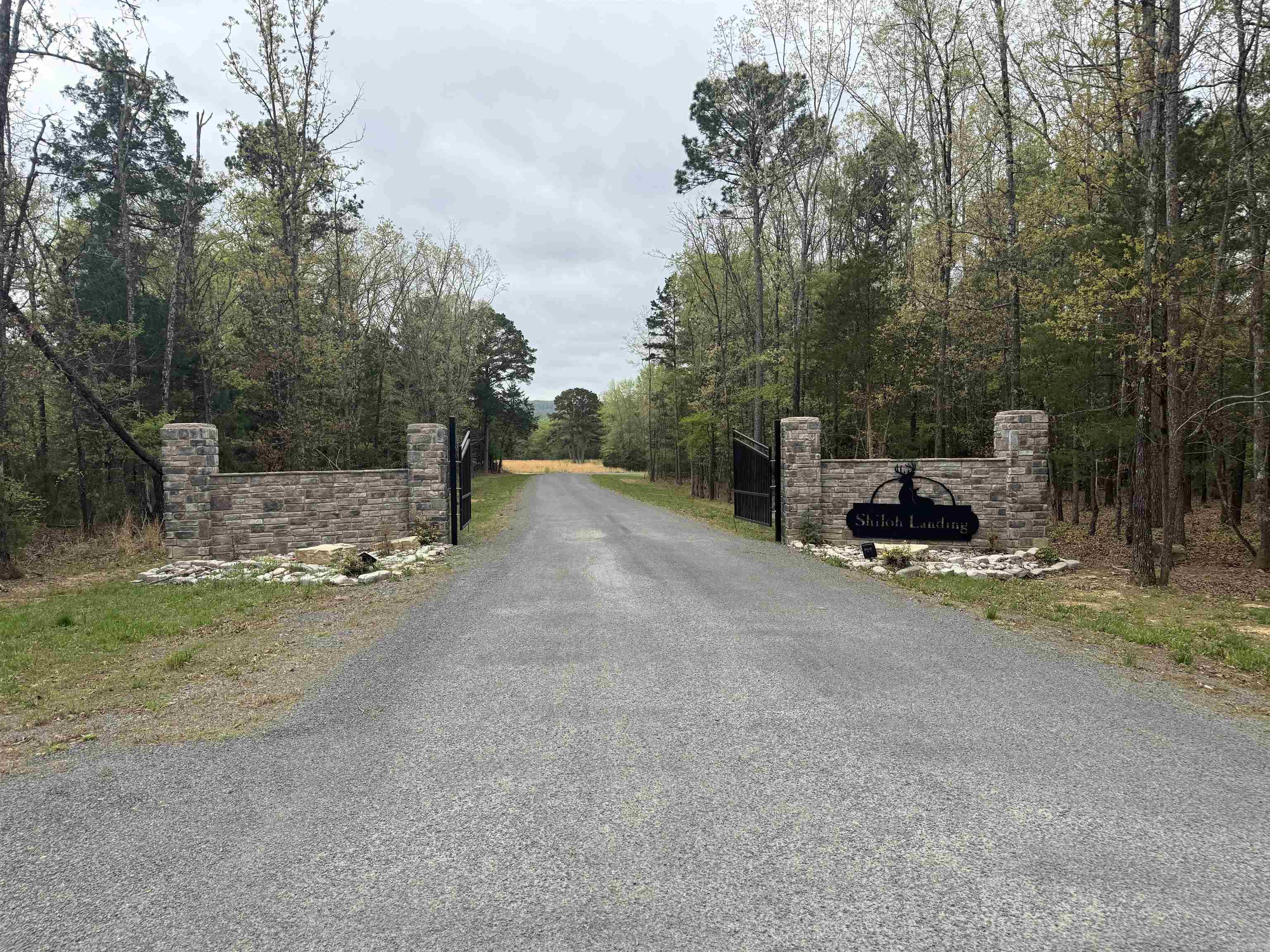 Build your dream home on this beautiful lot nestled in a new gated subdivision surrounded by tall trees.  Enjoy the perfect blend of privacy and community with access to a walking trail and a charming picnic area complete with a fire pit. Conveniently located less than a mile from Shiloh Marina, you'll have access to the water for boating, fishing, and outdoor recreation.