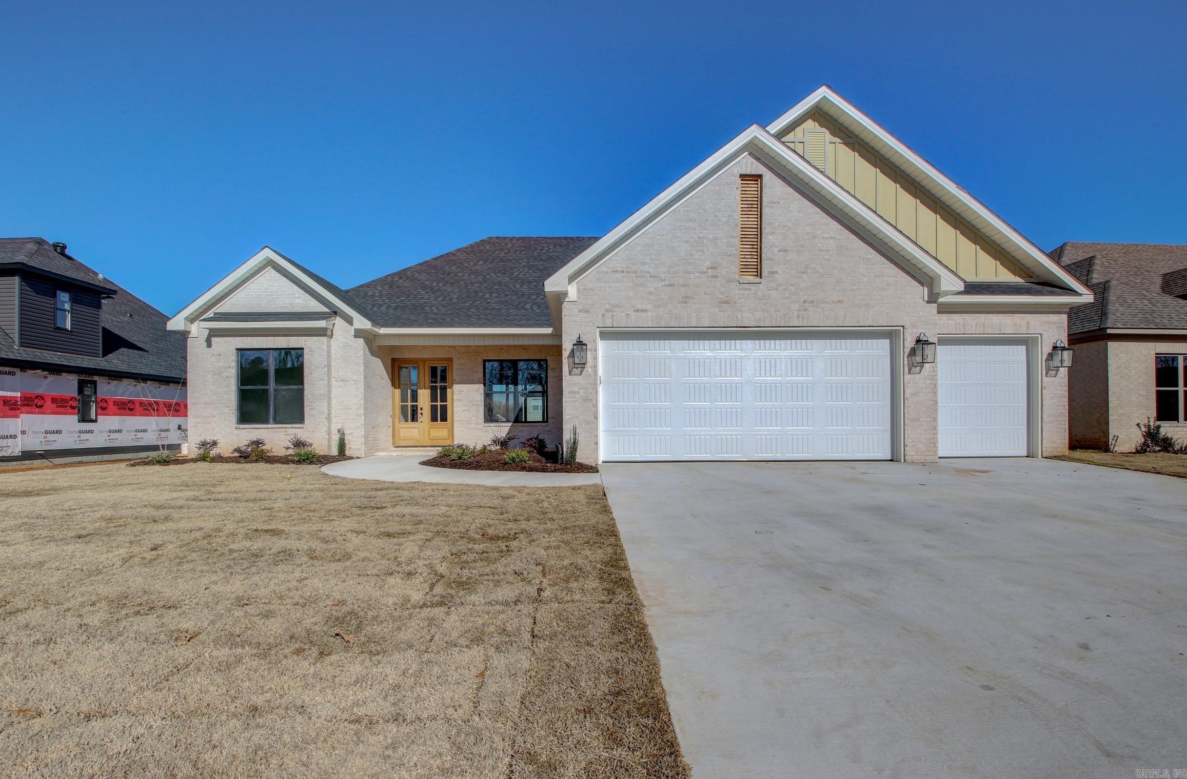 Beautiful ALL BRICK, NEW CONSTRUCTION home is one level on level lot in Country Club of Arkansas Subdivision. Double front doors make for a grand entrance to foyer. Large formal dining room. Spacious living area w/stone to the ceiling fireplace w/electric logs. Living area opens to gourmet chef's kitchen w/Quartz countertops, stainless steel appliances, gas range, pantry, convection oven & island/breakfast bar. Primary suite is fit for royalty. You immediately fall in love with the primary spa bath where you can wash all your cares away; double sink vanities, spa soaking tub and large custom tiled shower. The primary walk-in closet is massive w/built-ins. Separate laundry room leads to primary closet and locker area. 3 more guest rooms and full bath is located on the other side of the home. Half bath/power room for your guests. Relax on your covered patio after a long day or enjoy entertaining family & friends! The 3 car garage is a bonus to this amazing home. Stairs leading to the attic for tons of storage. Make it your home today!