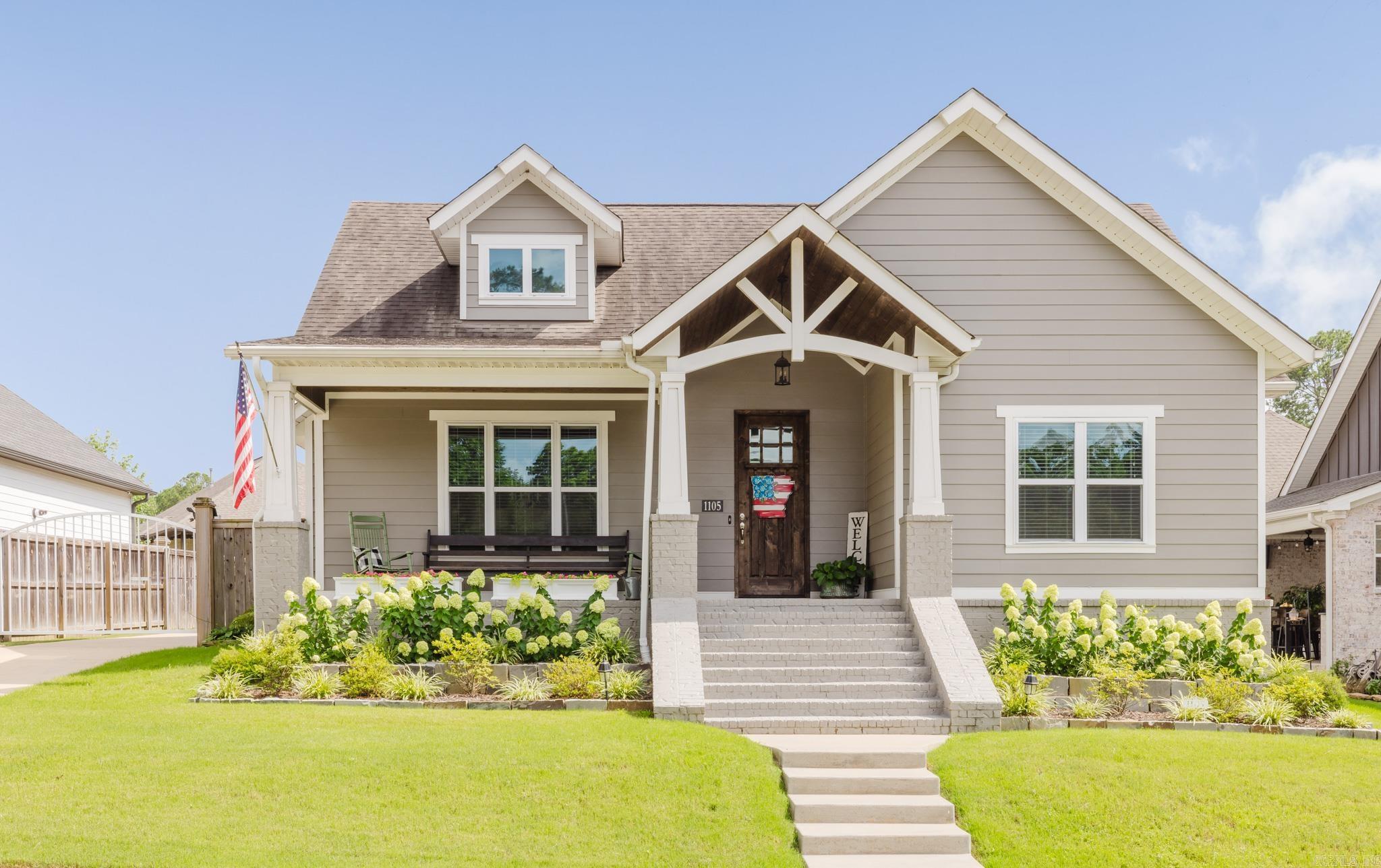 Welcome home to this beautiful Craftsman-style home in the desirable Sage Creek Subdivision, located within the Bryant School District! This 3-bedroom, 2-bath home offers a spacious, open layout that's perfect for both everyday living and entertaining. The oversized living room is anchored by a stunning gas log fireplace with a beautiful hearth, creating a warm and inviting gathering space. The open-concept kitchen features a breakfast bar, eat-in dining area, and flows seamlessly into the living room. A generously sized pantry and utility room provides plenty of extra storage to help keep everything organized. Outside, you'll appreciate the many recent improvements, including a new automated security gate, new landscaping, and updated drainage. Situated directly across from Mills Park, you'll enjoy easy access to walking trails, pickleball courts, playgrounds, and outdoor recreation. Conveniently located near Bryant schools, shopping, and dining, this home combines comfort, convenience, and an unbeatable location.