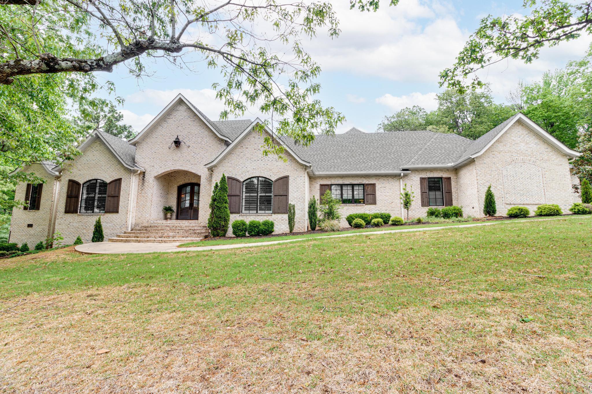 This custom built home has all the amenities you are looking for. It has 5311 sq. ft. heated and cooled and 7327 under roof, built in 2017. Soaring ceilings and 8 ft. doors throughout, adorned with wood casement windows allow natural light to flood in. Restore and relax on one of three porches, two are screened in and all flank the beautiful and very private pool. It has been meticulously maintained and is move-in ready. There are 3 bedrooms, 4 full and 2 half baths. Plus an upstairs bonus room that can be a 4th bedroom with built-ins in the closet, a full bath and room to include a game/tv area. The beautiful kitchen with custom cabinetry boasts 2 islands and is ready for a gourmet cook or family night fare. There is a 3 car garage with a storage closet and room to accommodate any project. It is a private oasis located in the prime area of Paragould. It is truly a home of uncompromising quality.