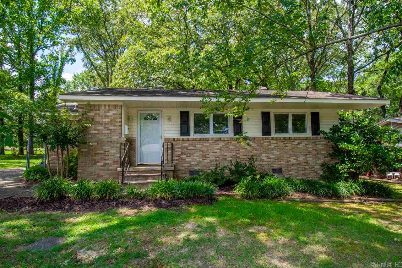 Totally updated home with a pool right next door for you to enjoy but none of the upkeep!!.  Home has wood floors throughout.  Totally remodeled, open kitchen with a large wrap around breakfast bar, & a gas stove. Screened porch, detached two car carport with tons of storage.  Updates - New siding, roof 2009, new windows, new doors, new blinds, new kitchen counter tops, new stove, new tub, new vanity, new commode, and new paint.