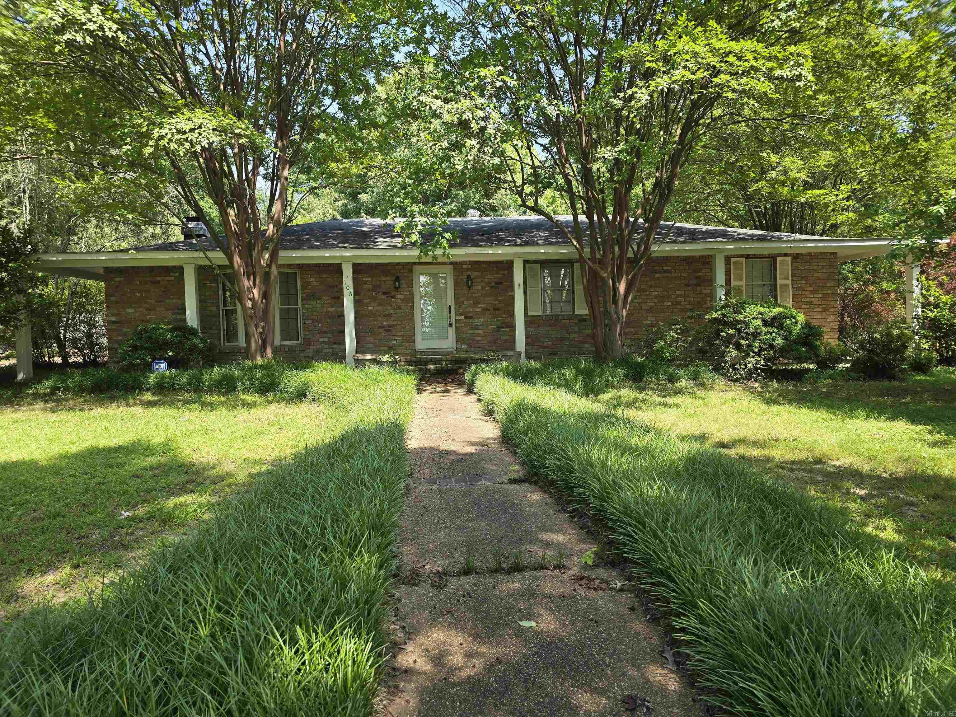 This one level, 3 bedroom 2 bathroom home is both exquisite and timeless. At over 2600 +/- square feet this spacious home has all the room you need to spread out. Upon entering the home through the tiled, large family room, you will immediately see 2 large storage rooms. Just off of the family room and down the hall is the laundry room and then kitchen #1. Yes, there are TWO kitchens. Kitchen #1 was converted from the old dining room in 2018. It has a small window between it and the original kitchen #2. Through the main kitchen will be the living room and dining room. Down the hall and past the front door foyer will be the Bedroom 1 and 2 with their bathroom across the hall. At the end of the hall will be the Master Bedroom with master bath. This home has SO MUCH space and is so thoughtfully laid out. Many updates were made in 2018 and 2019 including a new roof, new Central Heat and Air units, new paint, new closet door trim, new lights and fixtures, new carpet in bedrooms, new tub and surround, living room fireplace enclosed and new den doors. This home is ready for it's new family! Out back is a beautiful stone patio area with a HUGE inground swimming pool in need of restoration.