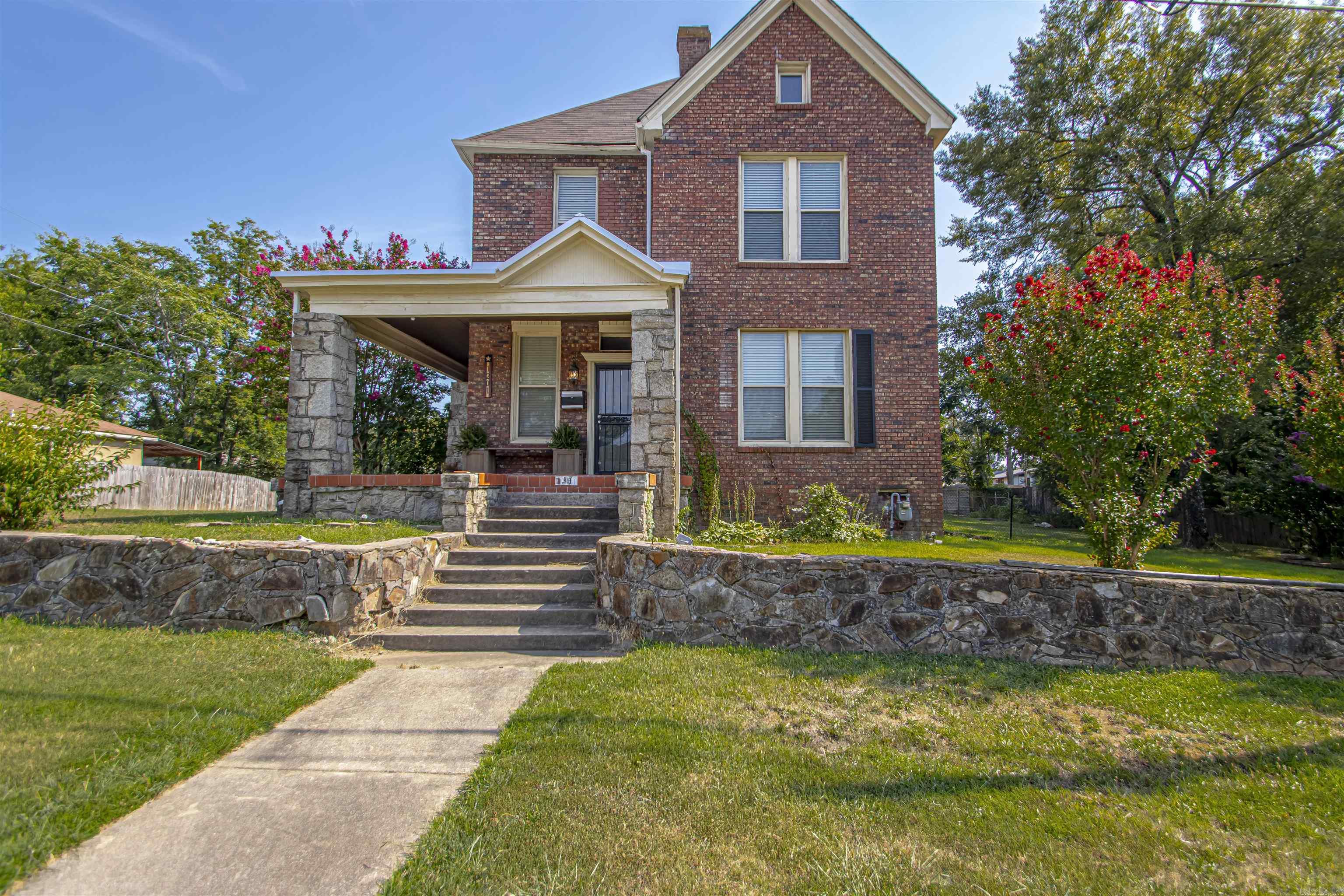 Need space that actually works for your life? This updated two-story offers multiple living areas, a huge yard, & room to spread out. This beautifully updated 1926 two-story is where timeless charm meet space & functionality that today’s families are looking for. On a large corner lot just under half an acre, there’s plenty of room to run, play, garden, or gather around a firepit for evenings outdoors. Inside, you’ll love the flexibility of two spacious living areas—perfect for movie nights, play space, or hosting friends/family - along with a separate dining room for holidays & special occasions. The updated kitchen features granite countertops & a commercial-grade refrigerator, making it a dream for busy households & entertaining alike with a half bath for guests. A gas starter fireplace creates a cozy spot to unwind. Upstairs offers large bedrooms with room to grow & great storage as well as 2 full bathrooms. The detached garage provides the perfect setup for a private office, or space for hobbies & has a full bath. With room to spread out, spaces to gather, and updates already done for you, this home is ready for its next chapter. agents see remarks.