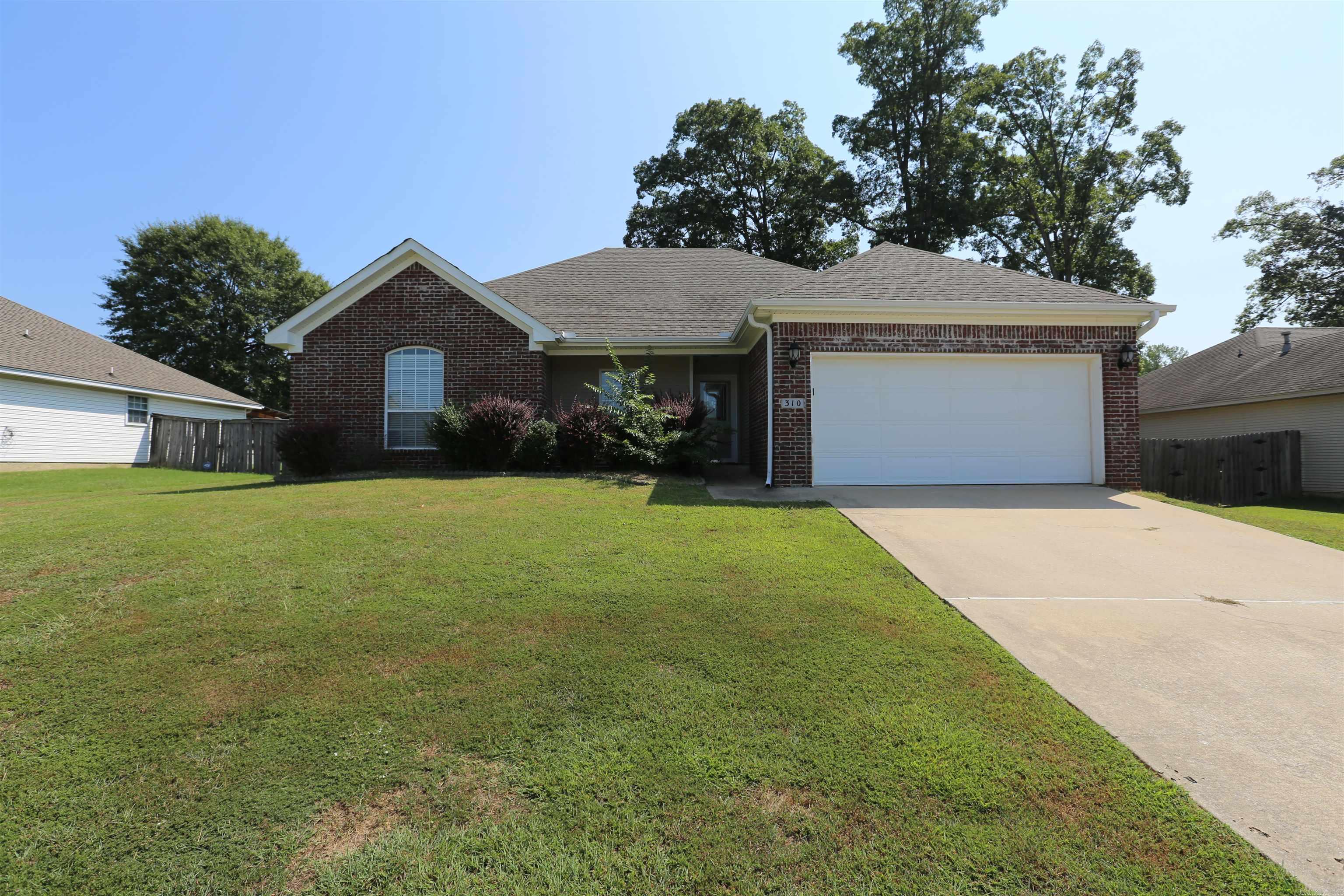 Welcome to 310 Stone Creek Drive, a charming residence in a serene neighborhood of Benton. This 4-bedroom, 2-bathroom home boasts comfortable living spaces, a spacious yard, and modern amenities. With its ideal location, this property won't stay on the market for long! This home is perfect for families and individuals alike, offering a peaceful retreat while remaining close to schools, parks, and everyday conveniences. Key Features: 4 Bedrooms, 2 Bathrooms -Generous Yard Space -Modern Kitchen - Cozy Living Room - Attached Garage.