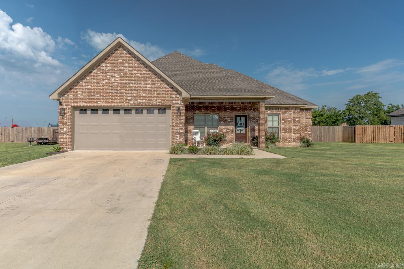 Welcome to Market 1202 Sutton Street in Manila, Arkansas! This beautiful 4 bedroom 2 bathroom home, built in 2025, is 1,658 square feet of thoughtfully designed living space.  The open-concept floor plan features a spacious living area that flows seamlessly into the kitchen, complete with a large breakfast island, modern finishes, and plenty of workspace for cooking and entertaining.  The private primary suite offers a custom walk-in tile shower, creating a relaxing retreat at the end of the day.  Additional highlights include a tankless gas water heater for energy-efficient, endless hot water, a spacious 2-car garage, and a covered back patio that's perfect for enjoying morning coffee or evening gatherings.  Situated on a 0.32-acre lot, the fully fenced backyard provides plenty of space for pets, play, or outdoor entertaining. Combining quality craftsmanship, modern amenities, and a desirable location, this move-in-ready home is one you won't want to miss.  Let's go see it!