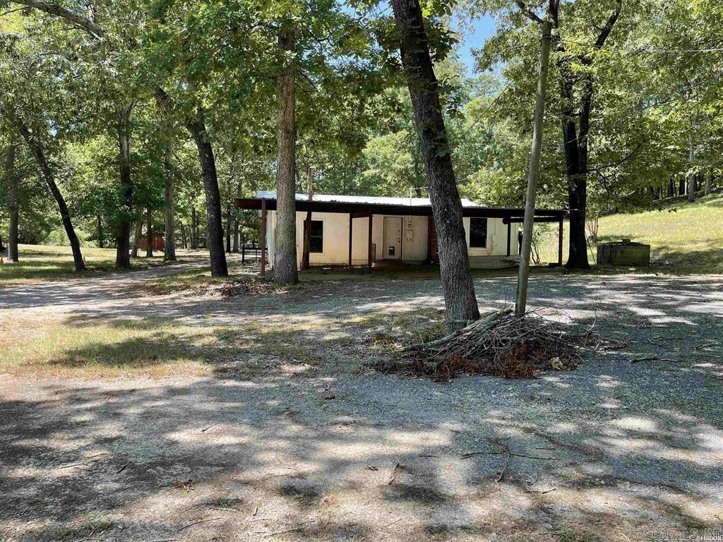 Lake Hamilton Lakefront.  Hard to find 1.3 Acres on level lot to waters edge.  Endless possibilities.    Can be main home, summer home, RV park, cottages. Owner/Agent
