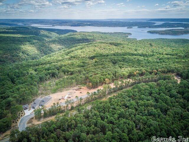 Panoramic views of Greers Ferry Lake from Osage Point development offering custom townhomes, vacant lots, & a library of floor plans from the builder (Ozark Resort Homes) or bring your own floorplan! Lake view lots include water extension, gravity sewer, underground electrical extension & phone.  Lot 123B extends across the street with space for Toy Garage!  Ask for complete list of lots & prices; lots can be purchased in 'bundled' groups to provide larger building area.  Choose yours & enjoy Resort Living!