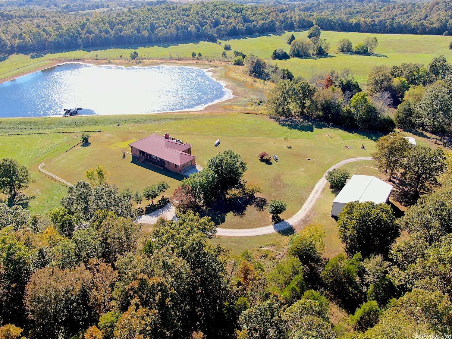 Premier County Home & Ranch. 4 bdr. 3 bath Santa Rosa Brick Home, approx. 5100 sq. ft. living area. Full finished walk out basement. Cypress wood walls and ceiling, CH&A, Jen Aire Range, Ref., DW, W/D, Freezer. Includes Hardwood, carpet & tile flooring, custom hickory kitchen cabinets, large pantry, sunroom , family room in basement. 40 x 60 heated shop, 45 x 90 hay barn, 2 equip. barns. Sits on 160 acres, 70 in pasture, 8 acre lake stocked with fish & boat dock. Plenty of wildlife. Great location.