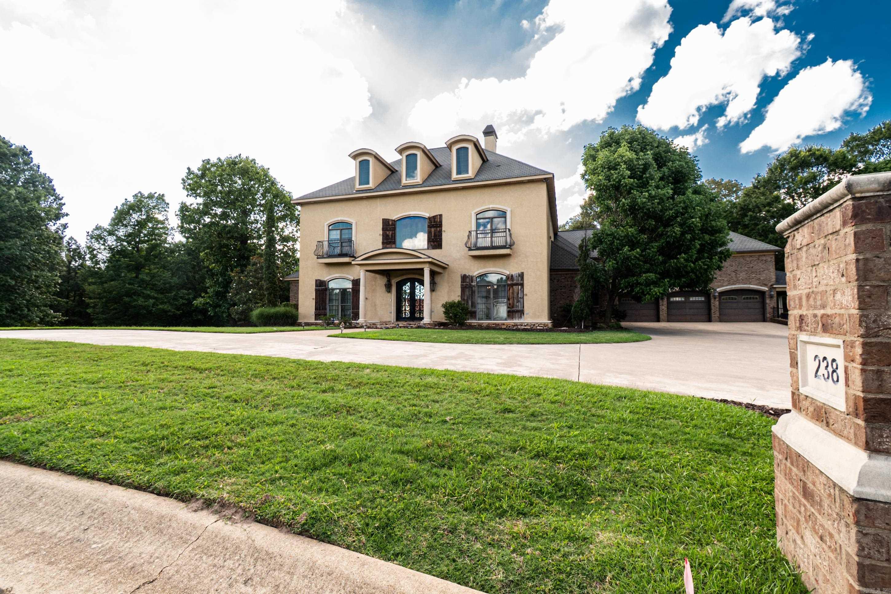 Stunning Mediterranean-style estate in the desirable Timber Hills Subdivision! Situated on nearly 2 acres, this exceptional 6-bedroom, 5.5-bath home offers luxury, quality craftsmanship, and outstanding amenities.  A grand entry with 21-foot ceilings and marble floors welcomes you into a thoughtfully designed home featuring 10-foot ceilings downstairs, 9-foot ceilings upstairs, solid wood doors, Pella windows, 6-inch walls, and superior insulation. Enjoy spacious living areas highlighted by two gas fireplaces with beautiful stone mantels.  The chef's kitchen is equipped with granite countertops, double ovens, a 5-burner gas range, two sinks, a trash compactor, walk-in pantry, and a wet bar with beverage cooler and ice maker. Additional features include a mud room, office, game room, and laundry rooms on both levels.  Step outside to a covered patio overlooking the beautiful ozone pool and fully fenced backyard. A 3-car garage, RV/boat storage, and a basement safe room complete this incredible property.  A rare opportunity to own one of Timber Hills' finest homes!