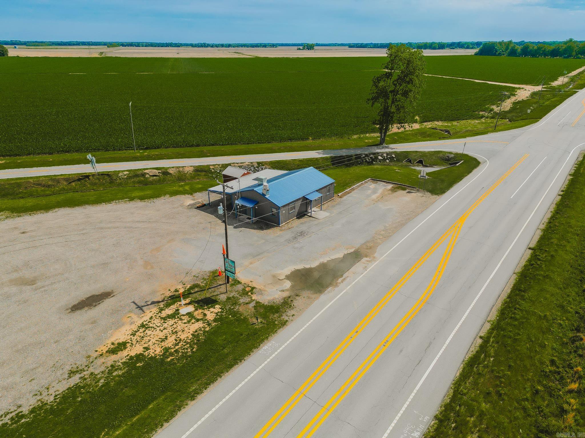 Commercial opportunity located on highly traveled US-165! Built in 2022, this approximately 1,300 square foot metal building offers low-maintenance construction with a metal roof and stained concrete floors.  Previously operated as a restaurant with an attached bait shop, this versatile property offers excellent visibility and endless potential for a variety of commercial uses. A full-building backup generator capable of powering the entire building conveys with the sale, along with kitchen equipment, tables, chairs, upright glass-door commercial coolers, ice maker, industrial-sized vent hood, and full surveillance system. The building also features a bathroom and a gas tankless water heater. The attached bait shop includes multiple live bait holding bays/tanks for minnows and bait storage. Additional features include a detached insulated storage building with a heating and cooling wall unit, covered rear awning area, and a large gravel parking lot with ample space for customers, boats, trailers, or work vehicles. Whether you continue its previous use or adapt it to fit your vision, this property offers visibility, easy access, and flexibility for your next business venture.