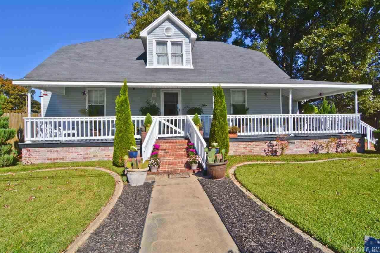 Beautiful Victoria style home located in the center of town on a large fenced corner lot, private back yard with above ground pool. With plum, apple, and huge pecan trees, tons of extra landscaping, very impressive.  Country front porch. Remolded inside but still has old world charm, master is down stairs & 2 beds on the 2nd floor with an additional sitting area. Gas stove and formal dining room. Must see! See agent remarks. Motivated Seller!