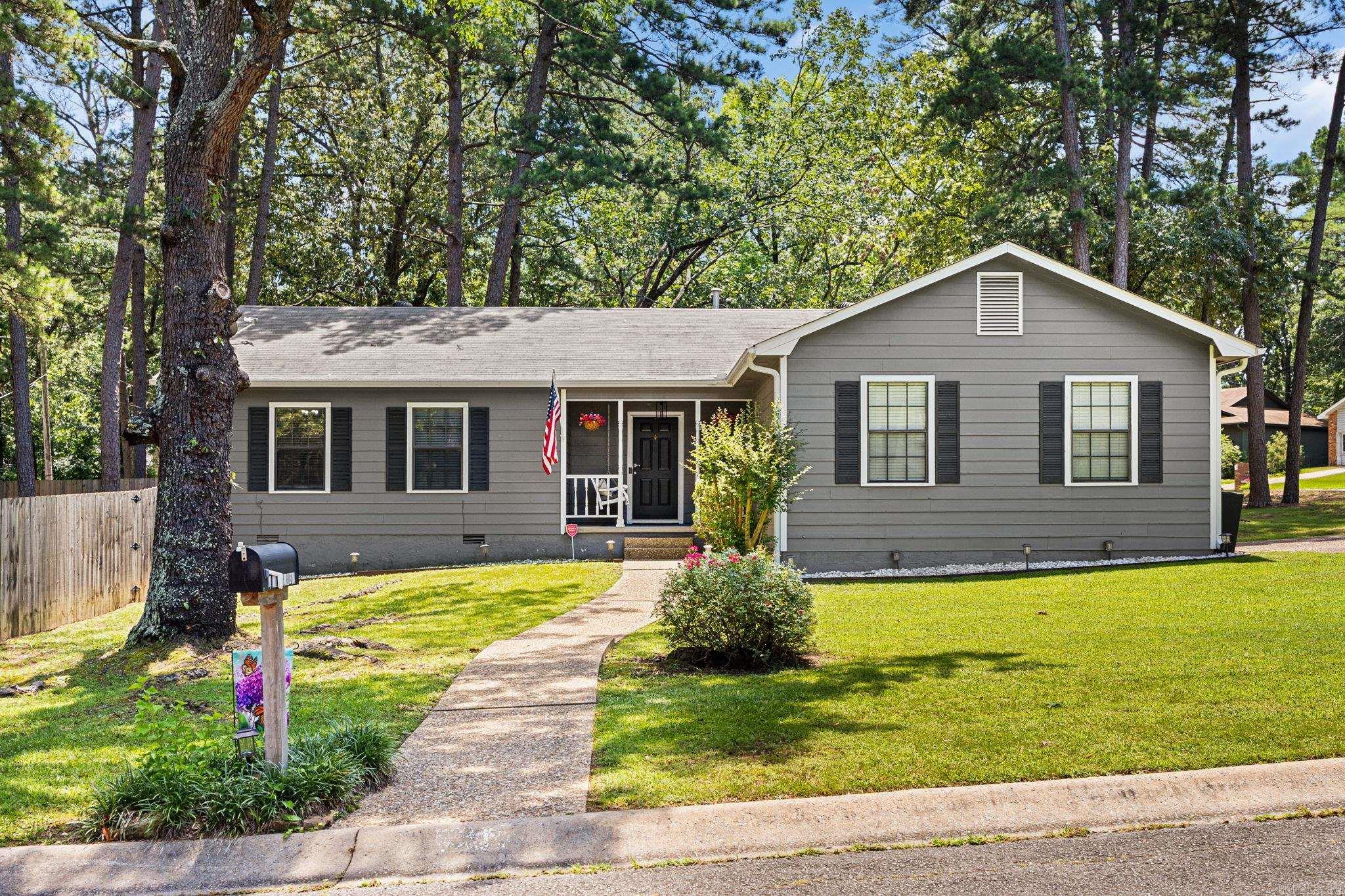 Welcome to 1 Woodview Court! Situated on a desirable corner lot in the heart of West Little Rock, this beautifully updated 3-bedroom, 2-bath home is move-in ready and full of charm.  Step inside to soaring vaulted ceilings, new luxury vinyl plank flooring throughout, fresh paint, updated lighting, modern hardware, and a over-sized living room.  The updated kitchen features stainless steel appliances, a farmhouse sink, updated countertops, refreshed cabinetry, and opens seamlessly to the living area.  The private primary suite offers a walk-in closet and an updated ensuite with a remodeled walk-in shower, new vanity, and updated countertops. Enjoy outdoor living on the covered deck with Bluetooth speakers overlooking the large, privacy-fenced backyard—perfect for entertaining or relaxing.  Conveniently located just minutes from shopping, dining, parks, hospitals, and everything West Little Rock has to offer, this home blends style, comfort, and an unbeatable location.  With an acceptable offer, sellers are leaving their beautiful stainless fridge AND washer & dryer also! Come take a look and see why we are certain you will want to know when you can move in and begin making memories!