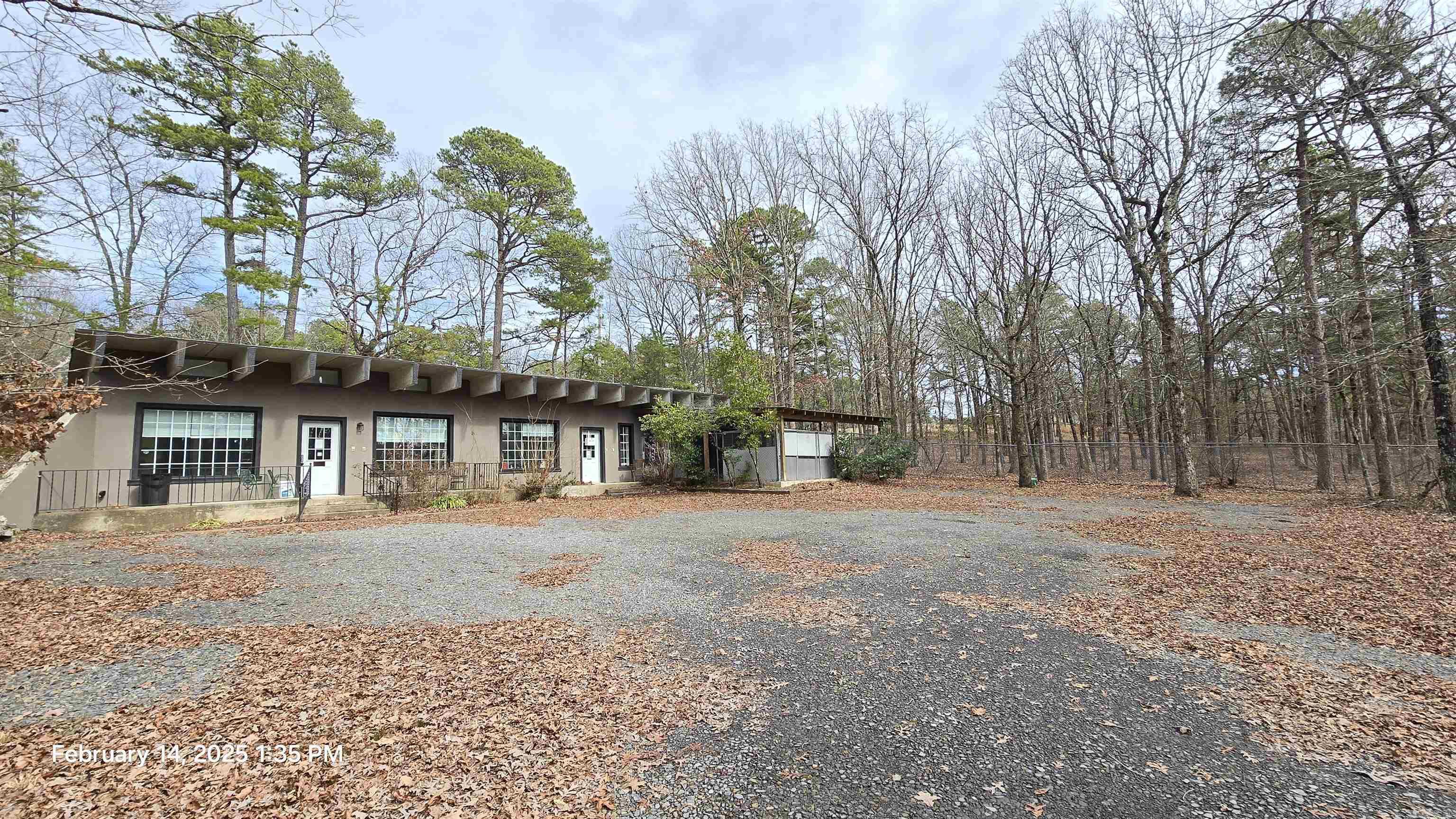 Built for year-round use, this structure features solid concrete exterior walls and roof, offering durability and flexibility for any layout you envision. The interior is ready to be finished to suit your needs—whether as an office, warehouse, shipping center, retail space, or even a live/work setup with a residence on one end. Conveniently located just off Hwy 16, this property sits on approximately 1 acre m/l, includes a fenced area for pets, and offers a private, secluded setting