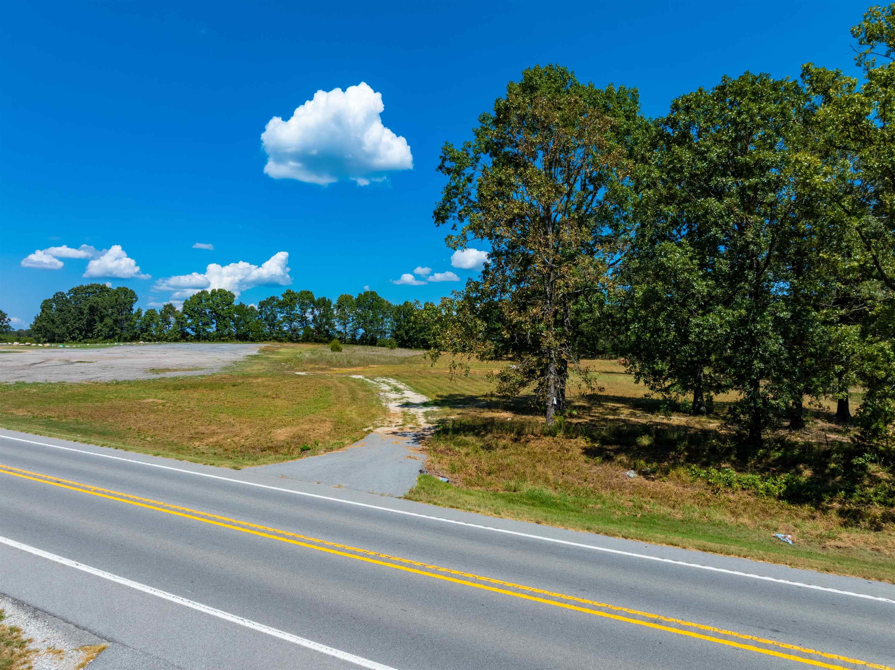 Prime Commercial Opportunity on Highway 62/412 – Fulton County, Arkansas  Looking for the perfect spot to build your business? This 6 +/- acre commercial property offers endless possibilities! Whether you’re dreaming of a warehouse, restaurant, storage units, or retail space, this location checks all the boxes.  Location Highlights:  Sits directly on Highway 62/412, with a private driveway entrance  Just north of Ash Flat, Arkansas and south of Salem, Arkansas in Fulton County  High-traffic corridor leading to Lake Norfork and the Mountain Home area  Excellent visibility and access for local and out-of-town travelers  Why This Property Stands Out Highway frontage ensures maximum exposure  Over 6 acres provides flexibility for building, parking, or expansion  Rare chance to secure a highly-traveled, high-demand location in the Ozarks