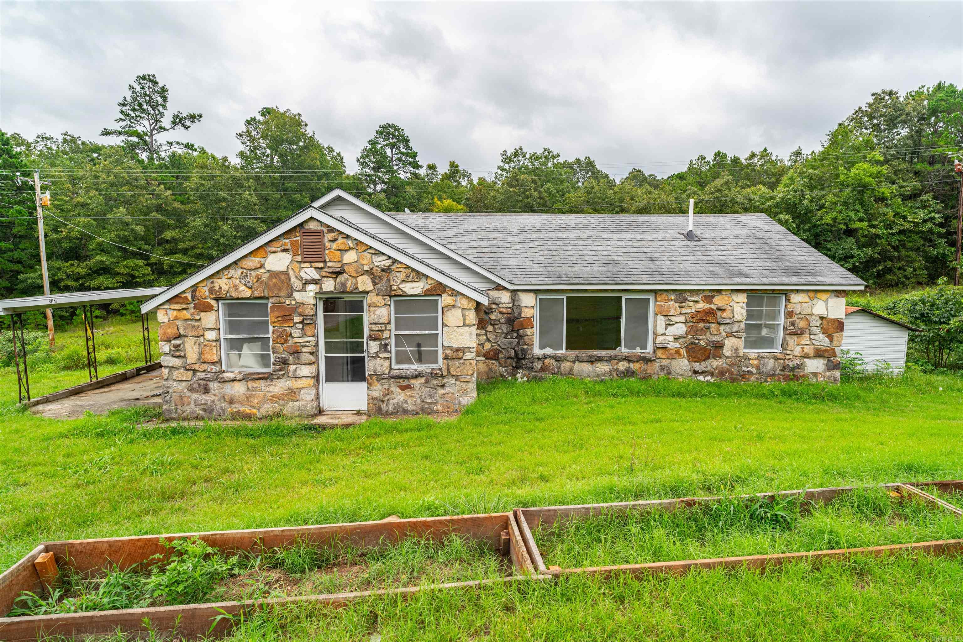 Charming fully remodeled 4 bed/2 bath home right off of Hwy 9 in Oxford, Izard County, Arkansas! Appx 10.5 Acres of woods sit behind this home perfect for hunting. This completely remodeled with new flooring, paint, an added bathroom, and new heat and air to be installed would make a perfect starter home or hunting cabin! It is perfectly laid out with 2 bedrooms and a bathroom on each side of the home for great separation if multiple persons were to stay here. Also outside of the kitchen and one of the bedrooms is a nice screened in porch! This one will NOT last! Set up your showing today!