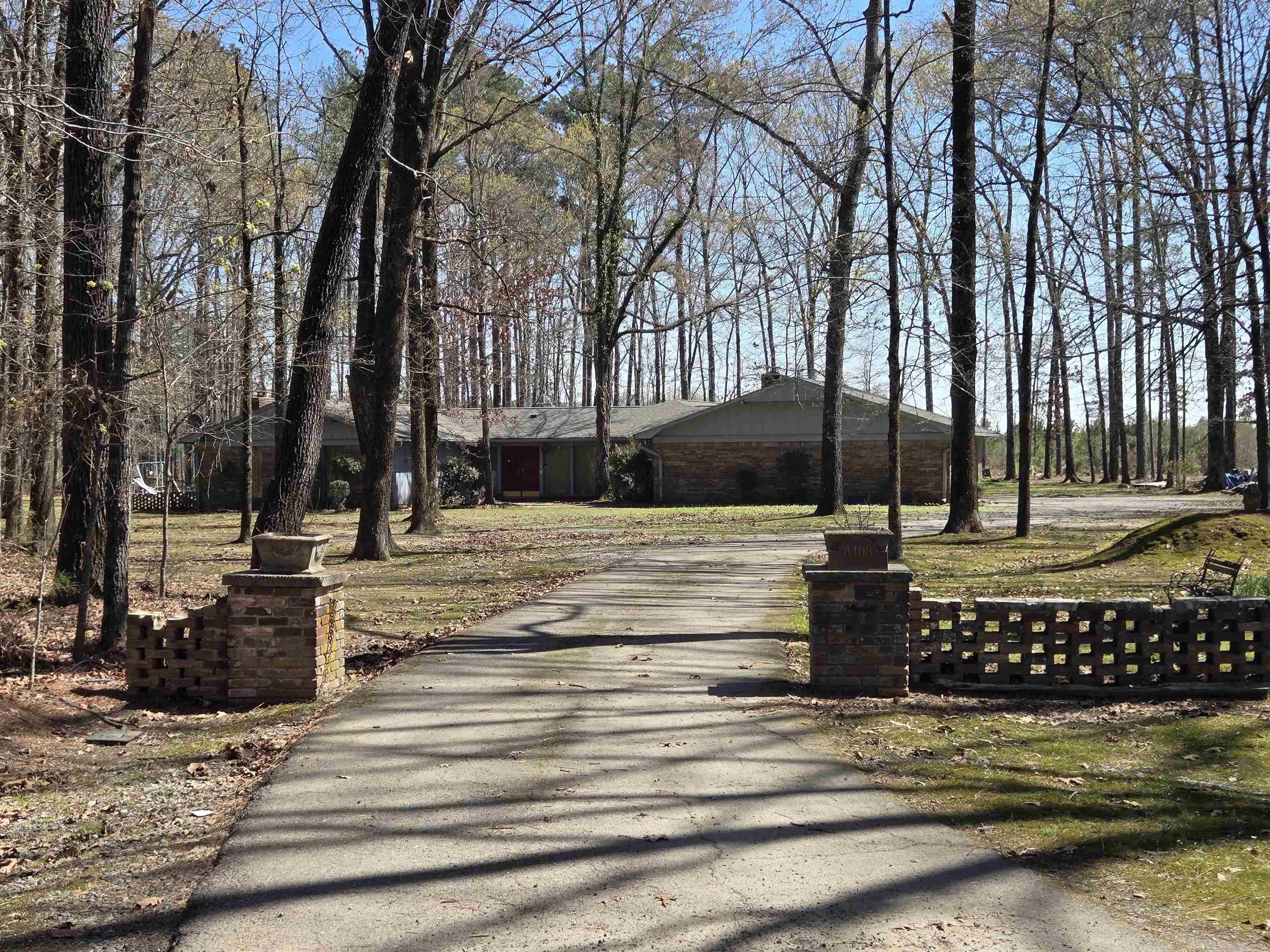 Rarely found 8-acre private retreat just 4 miles west of Pine Bluff in the Sulphur Springs community! Tucked at the back of a cul-de-sac on the southwest corner, this property offers true quiet country living with no neighbors within 500 feet. Even better, you own all the land surrounding the cul-de-sac, so no one can build near you. Home offers 3,140 heated sq ft, 700 sq ft carport (3,840 under roof), 3 bedrooms plus office/optional 4th bedroom, 2 baths including wheelchair accessible features, game room with bar, formal dining, and 2 wood-burning fireplaces. Updates in 2025 include new roof, new HVAC, and two new water heaters. Outside you’ll find a 16x36 in-ground pool, concrete patios, gazebo, split-storage shed, additional metal carport, and peaceful country surroundings. Shown by appointment only with 24-hour notice. Pre-approval or proof of funds required prior to showing. **Agents see agent remarks**