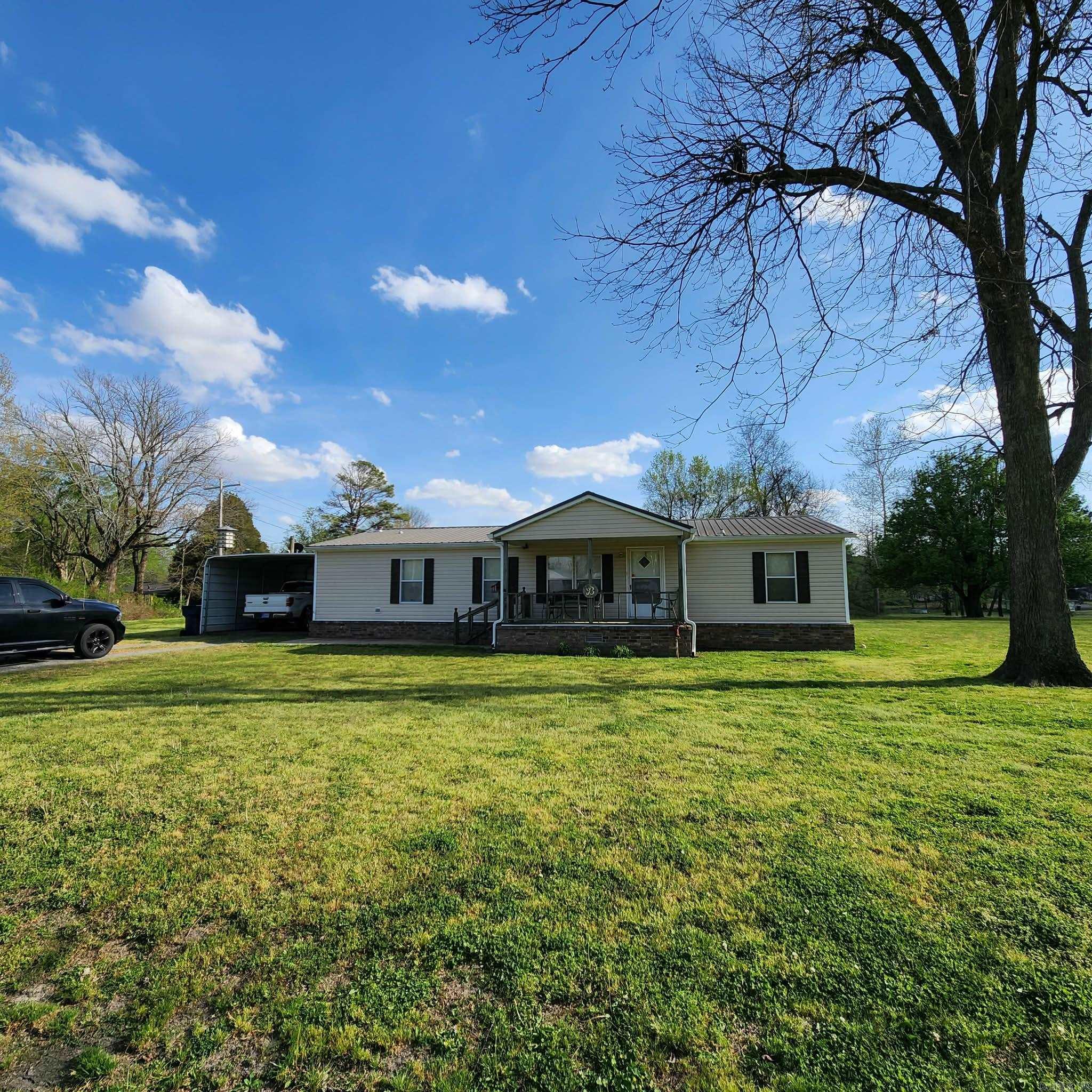Beautifully manicured large corner lot, carport, shop, storm shelter, dog pen, shed, where a nice & tidy 3/2 home with covered front & back porch sits in the middle of this welcoming property.  Brinkley sits at the southern gateway to the Cache River National Wildlife Refuge, home to 75,000 acres of bottomland hardwood forest prized by hunters, anglers, and birdwatchers. Seasonal activities include duck and deer hunting, bank fishing at Lake Greenlee, and hiking lowland trails. The area’s history with the ivory-billed woodpecker also draws birding enthusiasts.