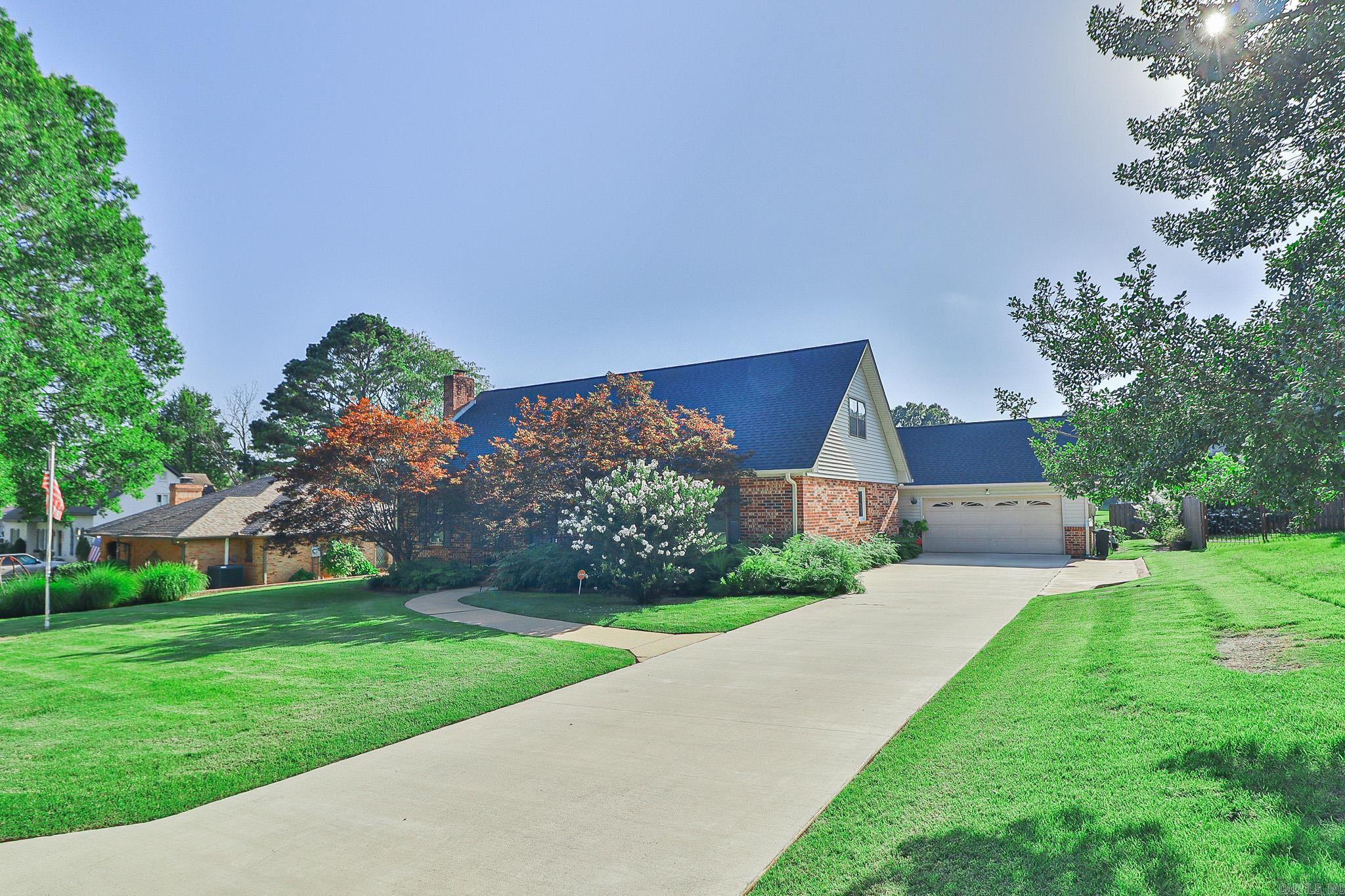This home offers approximately 2438 square feet with three bedrooms, two and a half baths. The primary bedroom is located on the main level. Attached two car garage with storage. Convenient location close to Jonesboro Country Club.