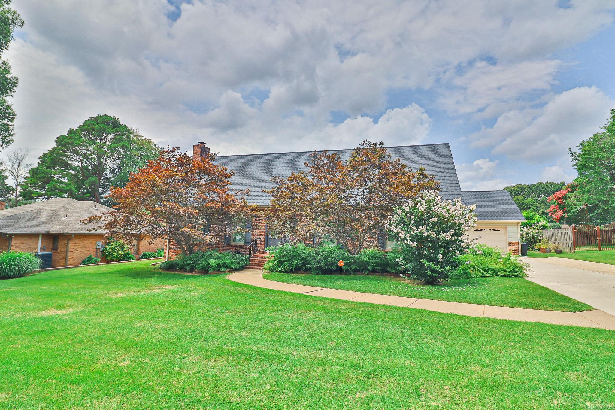 This home offers approximately 2438 square feet with three bedrooms, two and a half baths. The primary bedroom is located on the main level. Attached two car garage with storage. Convenient location close to Jonesboro Country Club.