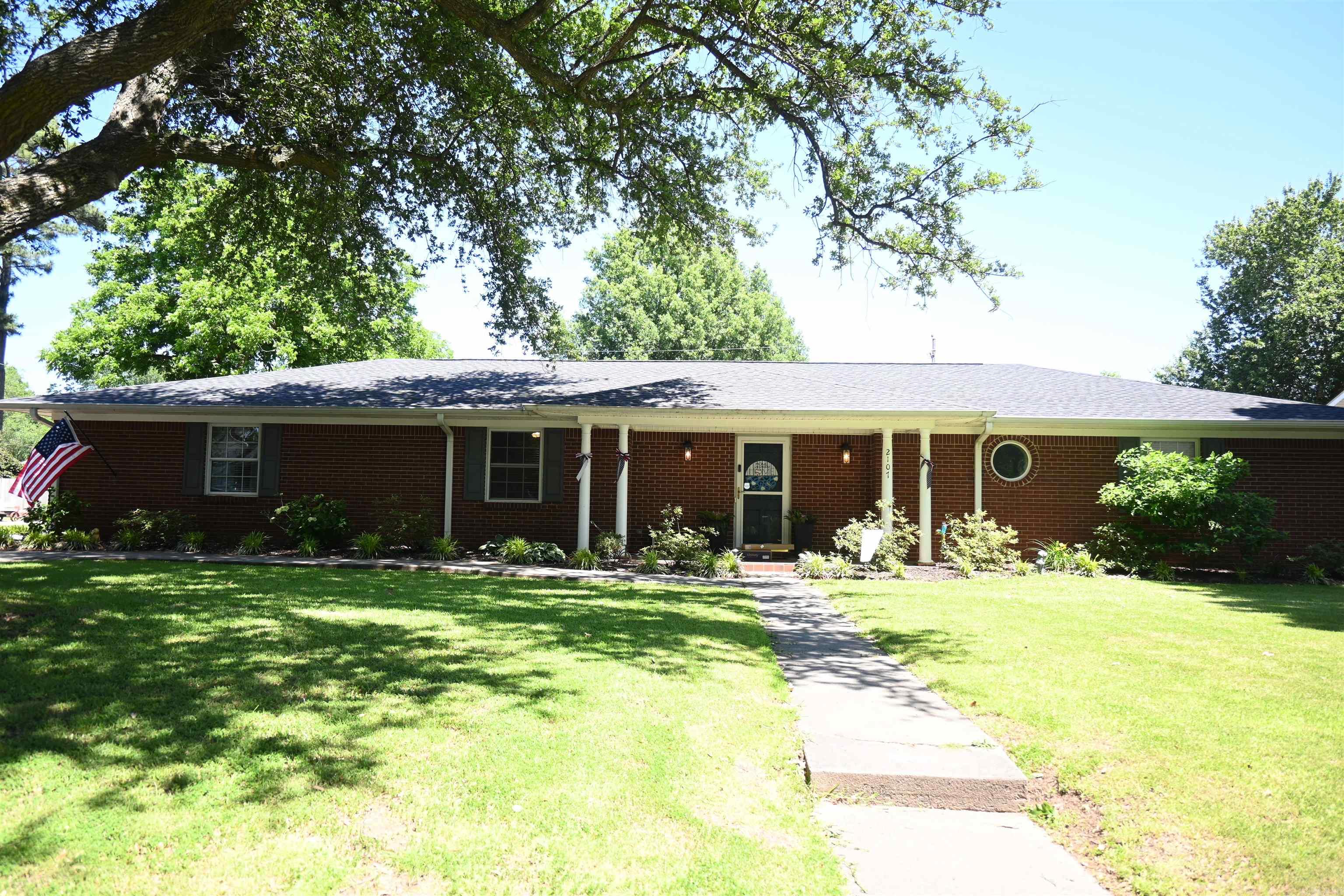 Wonderful home located in sought after neighborhood on a large shady lot. This home features a nice entry that flows to the large living space with great flow to the kitchen and dining area. Newer luxury vinyl flooring, updated widows, new paint, new roof 2024, new air system in 2023, new fence 2024 and numerous updates have been made. The bedrooms have a split floorplan. The primary suite is spacious with walk-in closet and bathroom with a large tub, walk-in shower, double vanity built-in storage. An office is adjacent to the primary bedroom. There are two additional bedrooms and bathroom with double sinks, tub/shower. The laundry room is conveniently located at the back door with a half bath. Outside find detached double garage with nice storage, large in ground pool, sounded by patio and grass with plenty of room for lounging and entertaining.