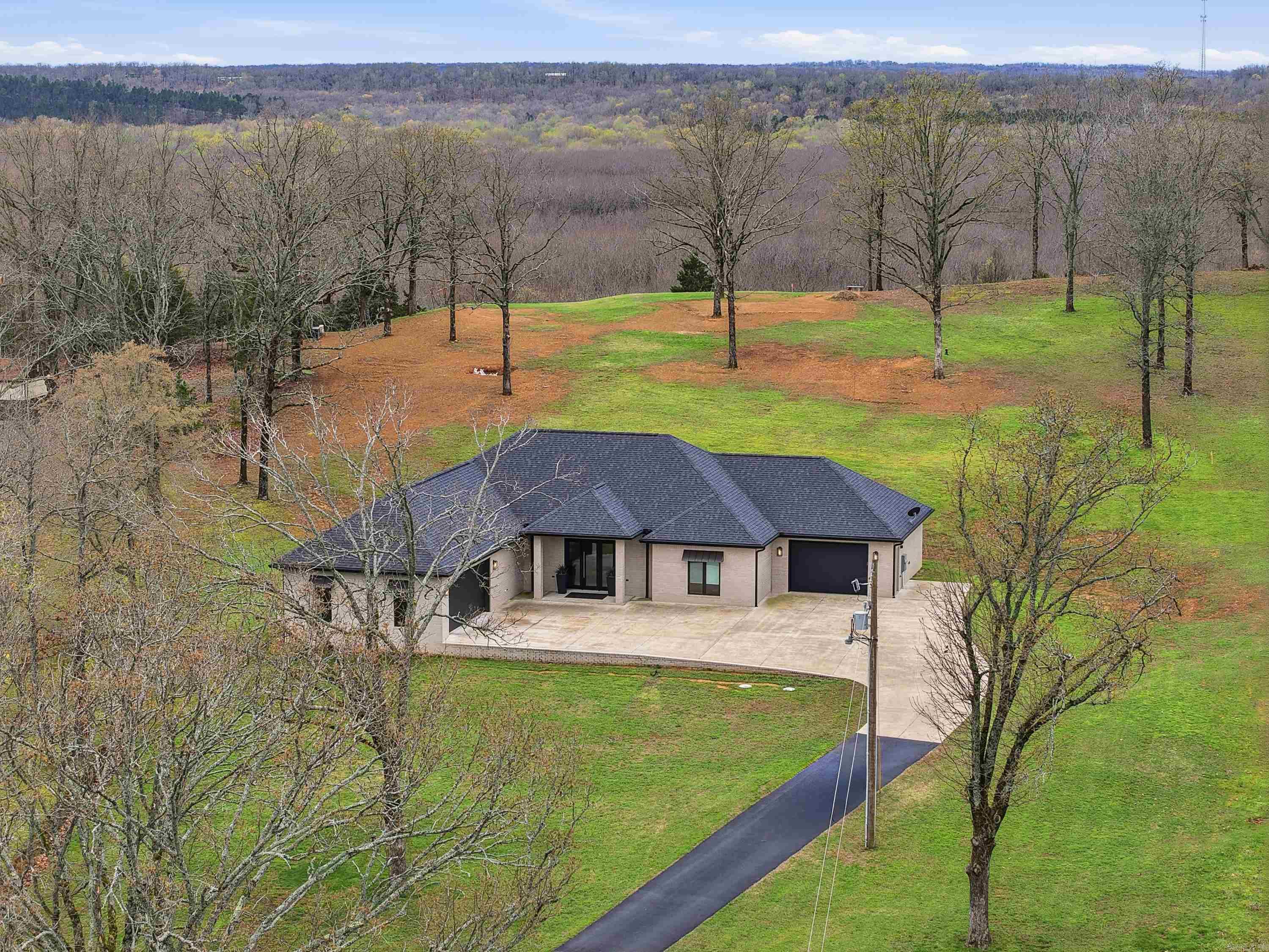Wow, Wow, Wow, Don't miss out seeing this Custom Built Builder Owned Gorgeous attention to detail home. Covered Front and Back porch perfect for viewing the picturesque 2 acres. Home still Like New, Child Free, pet Free and Smoke Free, this is a one of kind home/property. Tiled Flooring thru-out Kitchen is Stunning with Stained Maple Cabinets, Quartz Countertops, Walk in pantry and SS appliances, Open to a Large Living Room with Electric Fireplace, lots of Natural Light and built-ins. Home includes 2 1/2 Baths and 3 bedrooms (2 master suites)  or 2nd and 3rd can share the bath like a Jack/Jill.- Seller has used 3rd Bedroom as a Client Conference Room so it can also be entered from the back patio.  Let's not forget the added Features of a 5x6 safe Room, Huge Shoe/Storage closet and Great Built in office space. Home also includes a Attached 2nd Garage/Shop of 500sq ft great for Projects, Storage or man Cave. Central Vacuum System and Rain-bird Sprinkler System also included. Call Today for your showing, you wont be disappointed.  AGENTS SEE SHOWING REMARKS