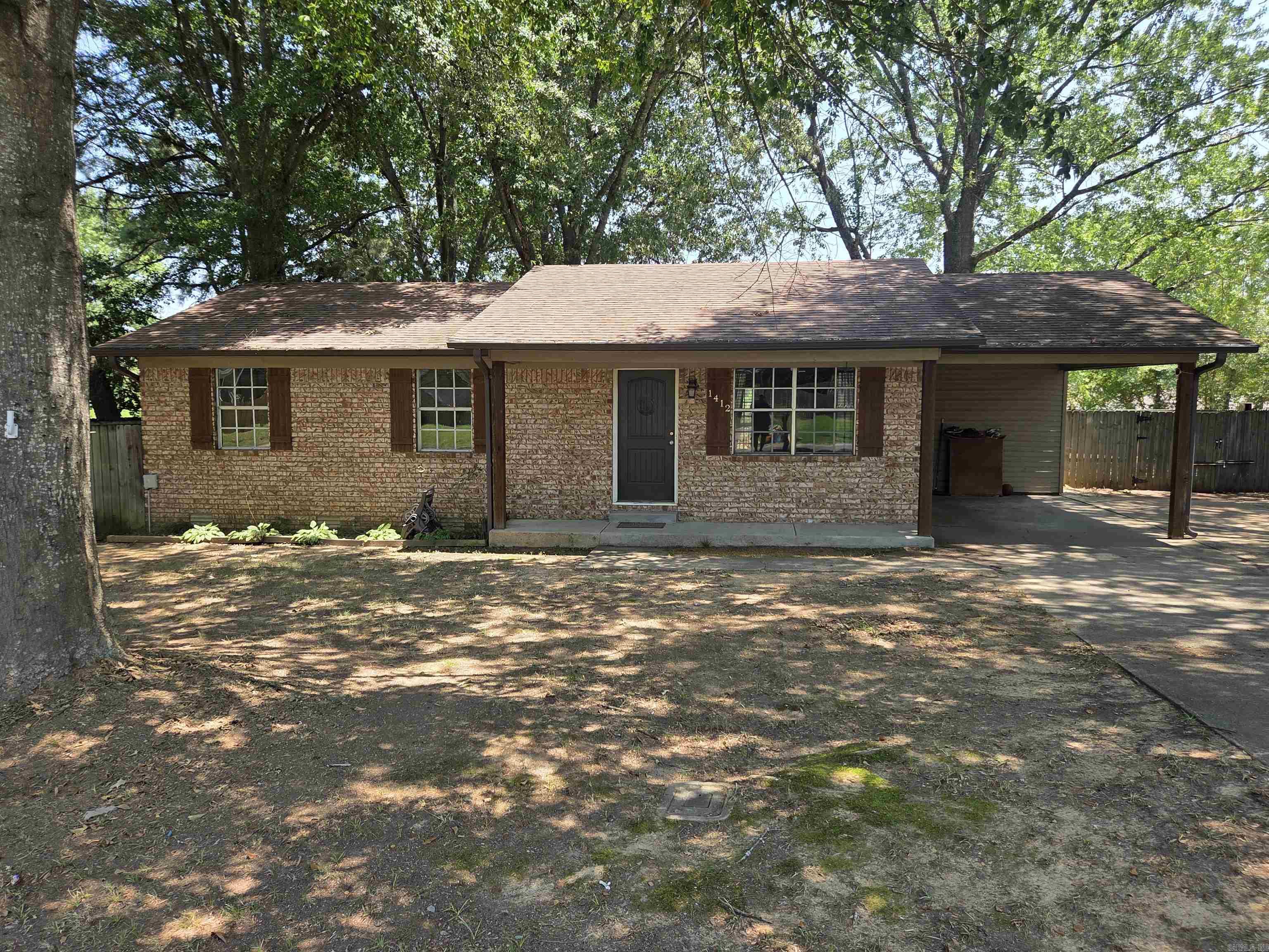 All electric 3 bed, 1 1/2 bath updated house in SW Searcy. This house has wood laminate floors in kitchen, living & hall, tile in bath & half & carpet in bedrooms. Spacious fenced in back yard, 16x32 shop with 10x28 lean to, almost 300' covered back deck on shaded East side for grilling & relaxing in the evenings. It has a carport with extra concrete for lots of parking. The NEW dishwasher & NEW refrigerator was just installed within the last 1 1/2 years, breakfast bar & granite countertops in kitchen & bar. The L shaped jack n jill bath connects to the main bedroom & the hall side has laundry hookups. Low traffic street with new homes being built before & after this neighborhood. Call for appointment. See agent remarks.