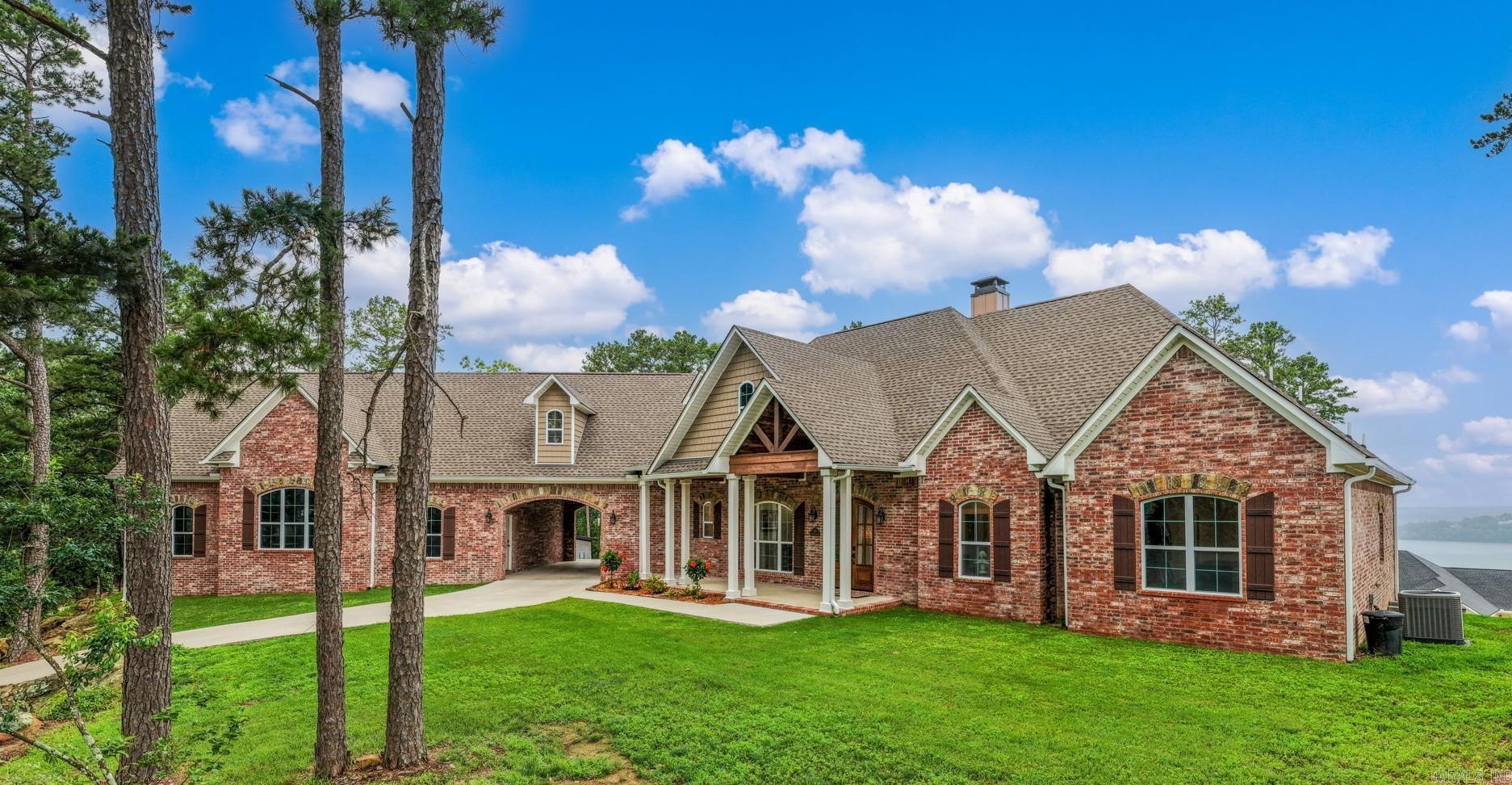 Extremely rare opportunity overlooking Beaverfork Lake! This custom-built, like-new home offers exceptional craftsmanship, thoughtful design, and breathtaking views throughout. The spacious kitchen is a chef's dream, featuring abundant workspace and storage. Generously sized bedrooms, ample storage throughout the home, and flexible living spaces provide comfort and functionality for everyday living.  Enjoy stunning lake views from the enormous screened-in porch complete with a cozy fireplace, perfect for year-round entertaining. The home offers 4 bedrooms plus a versatile flex room that could serve as a 5th bedroom, media room, or home office. Just off the kitchen is a truly unique gathering space currently designed as an old-fashioned diner, complete with a full counter and soda fountain. Car enthusiasts and hobbyists will appreciate the the portico leading to an oversized 3-car garage, including a bay large enough to accommodate a full-size RV. This  one-of-a-kind property combines luxury, character, and incredible views in a setting that is hard to find. Don't miss your chance to own your own private oasis overlooking Beaverfork Lake.