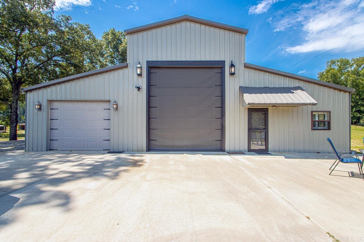 AMAZING UNIQUE HORSE PROPERTY ON 4 ACRES! Located in the heart of the East End Community and Sheridan School District! Owner built $36k, 1,900 square foot horse barn with 4 stalls, 2 large turn-outs, barn has water and electric.  House has spacious open floorplan with loft overlooking living area. Electric fireplace. Kitchen features granite countertops, stainless steel appliances and tons of storage. Additional living area w/ extra large roll-door plus additional garage. Tray ceilings and Master Bath with Jacuzzi Tub, walk-in shower, double sink and vanity. Heated/Cooled Workshop/bedroom.  Sale includes all appliances (inc. new Washer/Dryer) and 2 large mounted flat-screen TV’s.