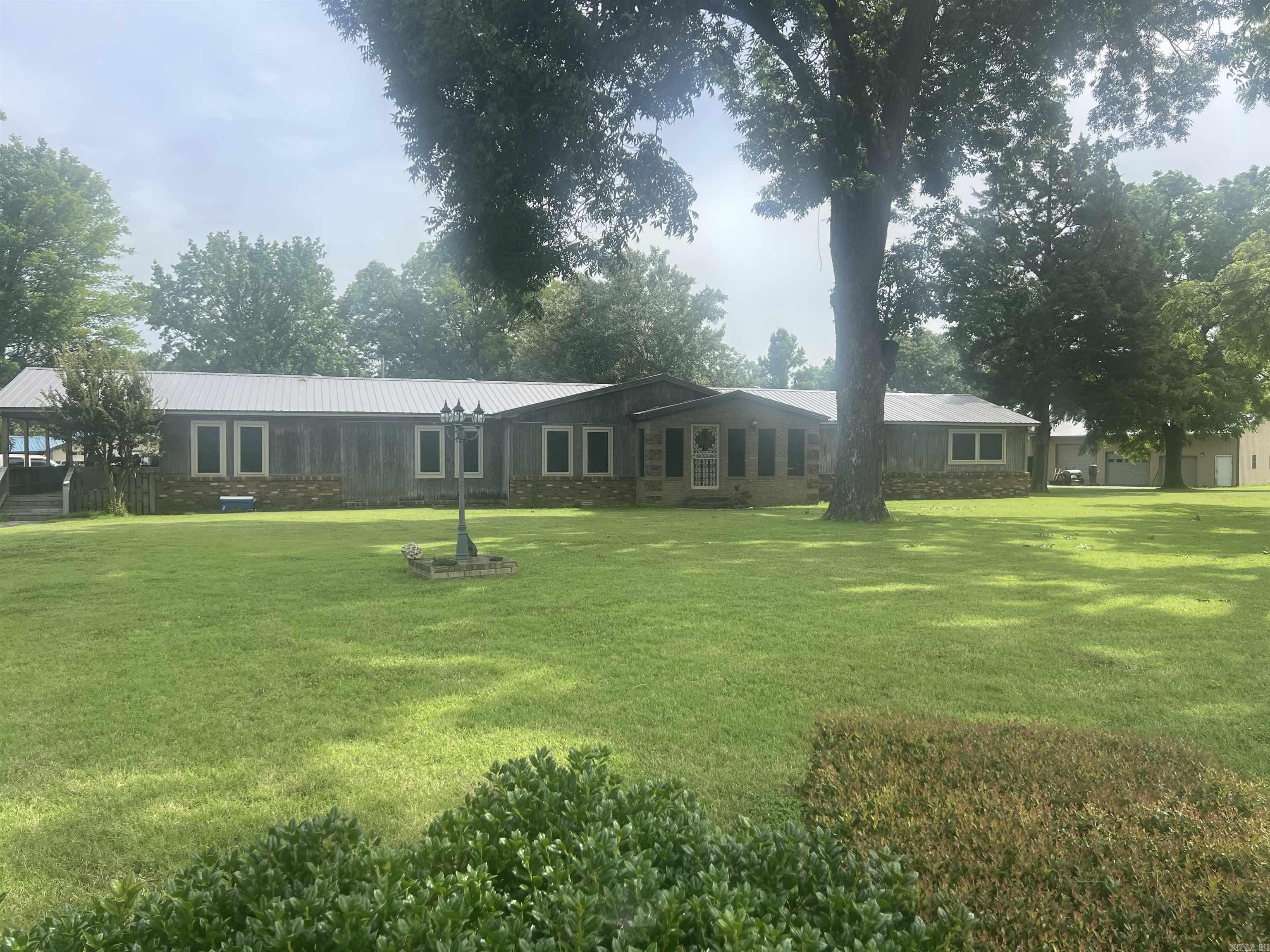This home provides the peace and tranquility that many long for, along with the spacious and outdoor setting around the gazebo.  The inside setting provides 3 spacious bedrooms, 3 bathrooms (1 handicapped accessible) and the property sits on 1.93 acres offering the perfect blend of comfort, space and privacy.  Inside you will find a Master suite with in-suite bathroom. Two additional rooms with an additional full bathroom offers the perfect flexibility for a family or guests. In addition to the main living area, the home features an additional living area as well.