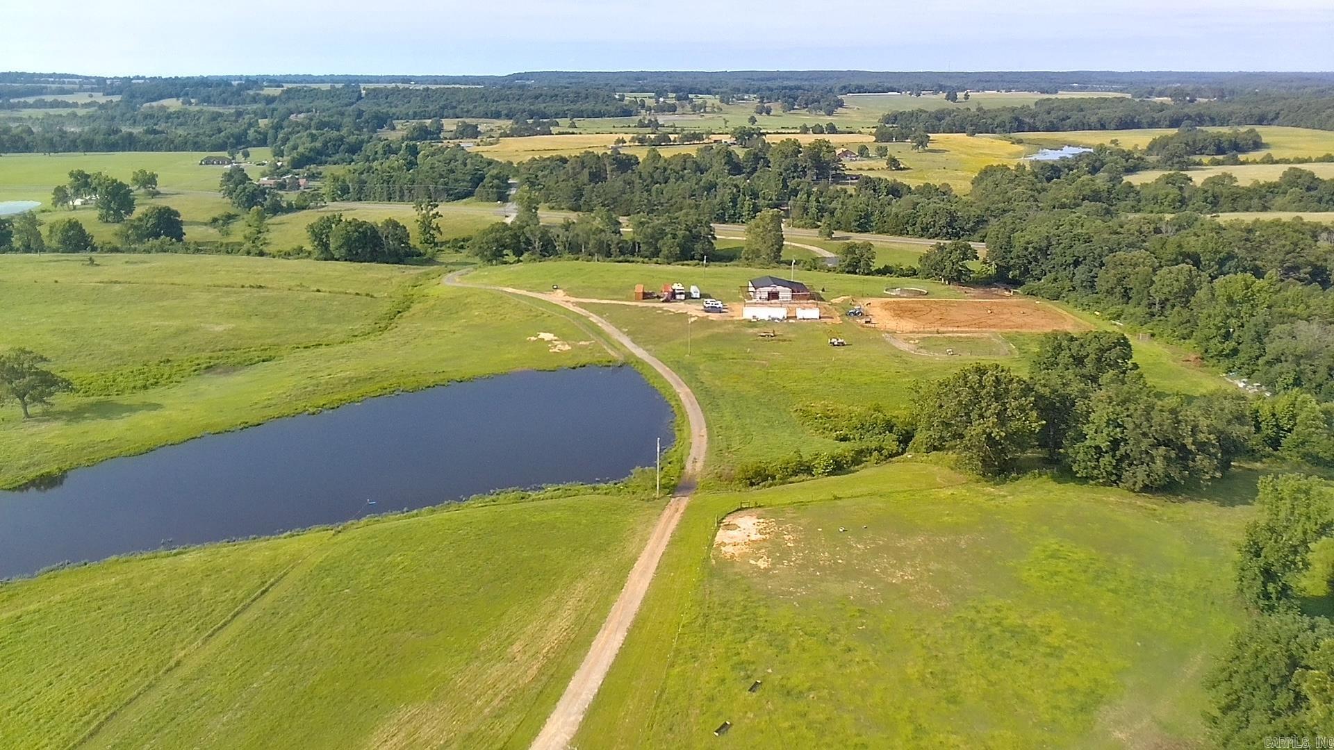 Discover the perfect blend of recreation, equestrian amenities, and country living on this exceptional 69.7-acre property just outside Rosebud, Arkansas. This beautiful farm is ideal for horse enthusiasts, outdoor lovers, or anyone seeking a peaceful rural retreat. The property features a fully stocked pond known for trophy-class bass fishing, offering outstanding year-round fishing right on your own land. Equestrian improvements include a spacious barn with seven horse stalls and an outdoor riding arena, making it move-in ready for horses and livestock. The gently rolling acreage provides a mix of open pasture and scenic countryside with endless opportunities for riding, farming, recreation, hunting, or building your dream home. Whether you're looking for a working horse property, weekend getaway, or private country estate, this unique property offers the space, amenities, and lifestyle you've been searching for. Conveniently located just a short drive from Conway, Searcy, and Little Rock, this is a rare opportunity to own an amazing property. ****See Agent Remarks***