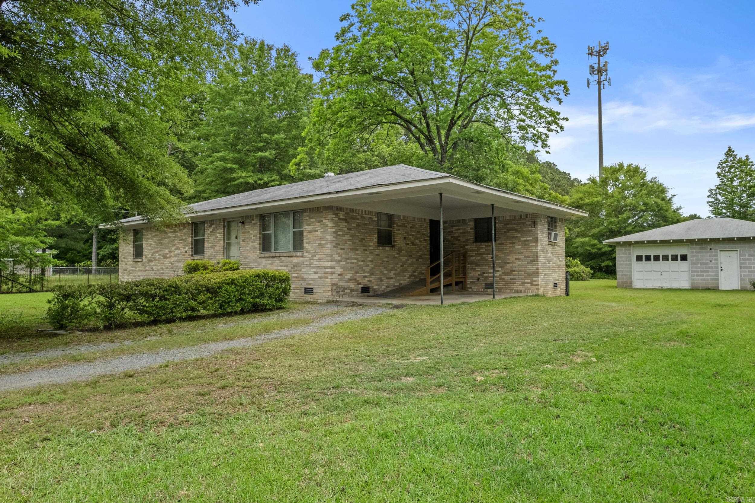Investors and First-Time Buyers, don't miss this one-owner home on 0.48 acres in Little Rock. This well built 3 bedroom home offers great potential with a 1-car carport and plenty of room to make it your own. With a little TLC, it could be a wonderful home for a single person, small family or an excellent remodel. A large cinder block garage/shop adds even more value and could potentially double as a storm shelter. Refrigerator and gas dryer conveys. The HVAC was replaced in 2024. HWH 4 years old. Take a look today!! See Showing remarks
