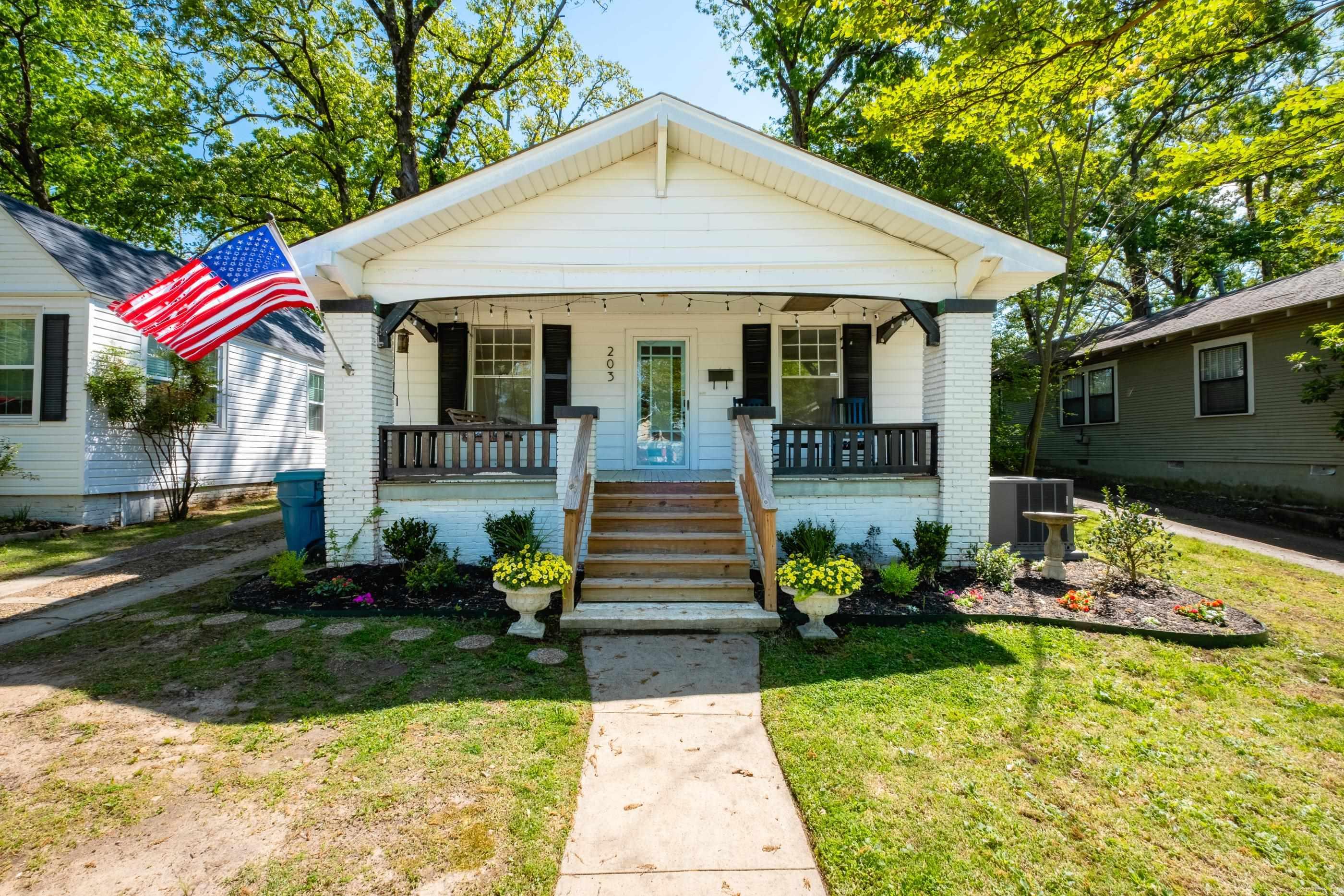 The epitome of a charming Hillcrest bungalow! This 2-bedroom, 1-bath home features a welcoming living room and dining room that flow seamlessly into an updated galley kitchen with new tile. The expansive primary bedroom overlooks the backyard and is filled with an abundance of natural light from wall-to-wall windows. Step outside to a large, flat backyard complete with a greenhouse and convenient rear alley access. Recent updates include fresh interior paint throughout, a new hot water heater, and a brand-new refrigerator that conveys. Ideally located, you can walk to all of Hillcrest’s most popular shops, restaurants, and parks! Come see today!