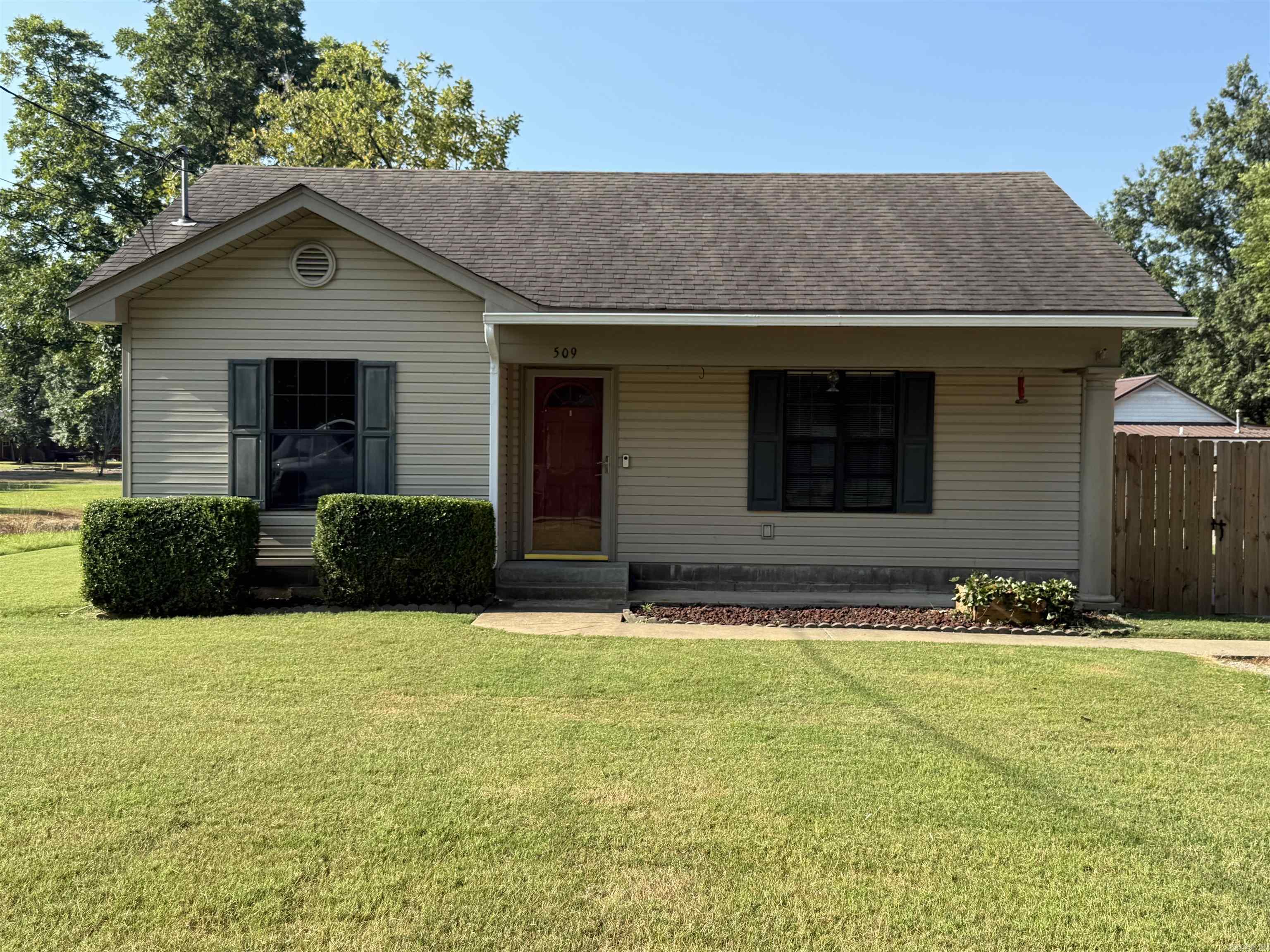 Charming, move-in ready home in Lake City! This 2-bedroom, 1-bath home offers just over 900 square feet of comfortable living space with a smart, spacious layout. The vaulted ceilings in the living room create a bright, open feel, while the large kitchen offers great cabinet space with trendy two-tone cabinetry—white uppers and gray lowers. Enjoy your morning coffee or quiet evenings in the sunny bonus room, perfect for a home office, playroom, or reading nook. Refrigerator, washer, and dryer all stay with the home—just bring your boxes. The fully fenced backyard is perfect for kids, pets, or hosting friends for a backyard BBQ. Located in a quiet neighborhood with easy access to town, this home is ideal for first-time buyers, downsizers, or anyone looking for low-maintenance living in a peaceful setting.