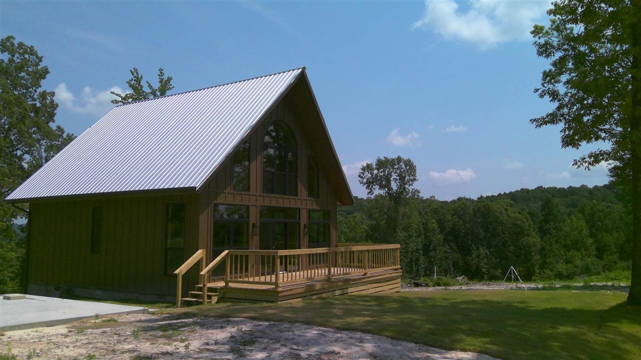 New and Finished! GORGEOUS brand new, custom built, modern, 3 bedroom, 2 bathroom, split level  home with a beautiful view of the mountains on 10+/- Acres! At 1300+/- sq ft heated and cooled with 900+/- sq ft being on the main level and 400+/- sq ft being upstairs, this home is perfect for efficient living. All new appliances including a refrigerator, dishwasher, free standing stove & microwave. The home has ducted electric mini splits. In the living room, there is also a gas log fireplace for back up heat.