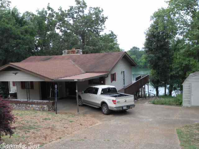 Don't miss this opportunity of a lifetime to live in a very nice lakefront home on a 640 acre lake with great fishing and water sports at a very affordable price. Home had been recently remodeled by present owners and is ready to move into. The open floor plan on the main level offers a lake view from almost every window. The basement is finished and has a second fireplace. This home is very energy efficient. IT IS A MUST SEE!This home has lots of extra features.