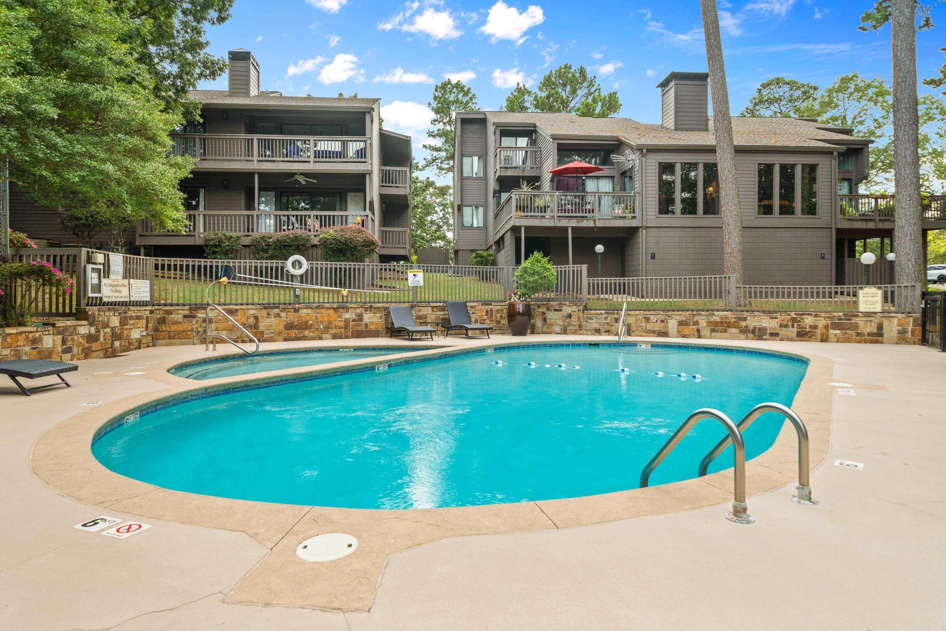 Rarely does a condo in this price range offer Three full bedrooms and Three full baths...a hard-to-find combination that sets this property apart. Tucked away in the gated South Shore subdivision, this ground-level unit features large picture windows and multiple balconies, giving you a front-row seat to the resort-style amenities - with the pool, sundeck, and tennis court all just steps away. The view blends the crisp blue of the pool with lush green trees and landscaped grounds, capturing both the energy of South Shore Resort, and the privacy of your own retreat. Inside, each bedroom is its own en-suite, complete with a private bath-ideal for guests, family, or rental flexibility. You’ll appreciate the granite countertops throughout, and thoughtful finishes that bring both comfort and style. This home has been lovingly cared for by the same owner for over 25 years, evident in the pride of ownership throughout. In addition, short-term rentals are allowed, making this a fantastic investment opportunity as well as a primary residence. With its rare layout, prime location, and income potential, this is the kind of opportunity that doesn’t come around often.
