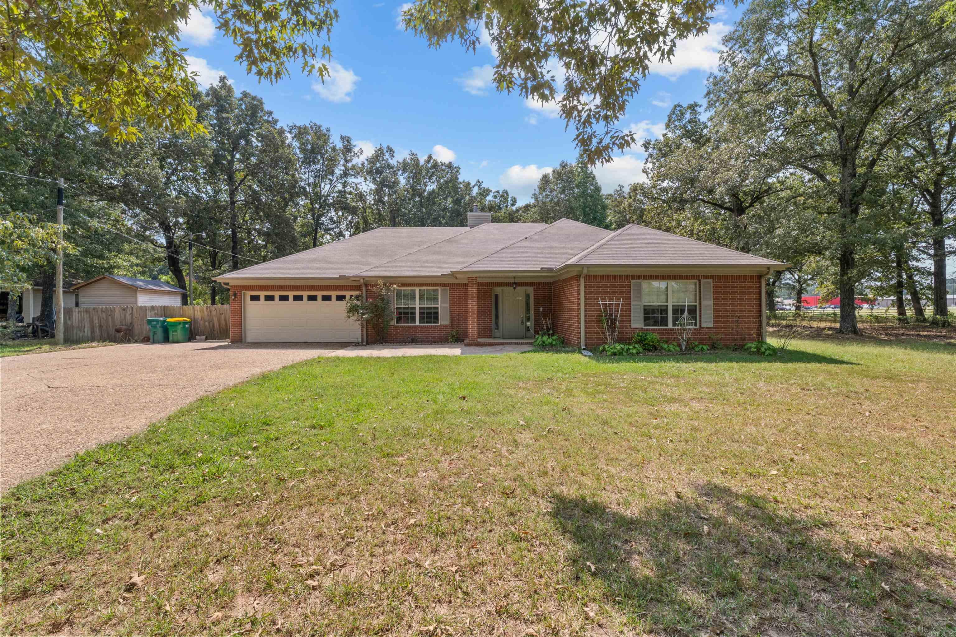 Country living never looked so good! Nestled on a spacious .82-acre lot, this move-in ready home offers the perfect blend of comfort, style, and room to breathe. Step inside to an inviting open-concept floor plan designed for both everyday living and effortless entertaining. Featuring 3 bedrooms and 3 full bathrooms, there's space for everyone to spread out and feel at home.  The cozy fireplace creates the perfect gathering spot, while the screened-in back porch invites you to slow down and enjoy peaceful mornings, relaxing evenings, and the beauty of country living—without the bugs! Fresh new flooring, neutral colors throughout, and a roof that's only a few years old mean the big updates are already done for you.  From the functional layout to the welcoming finishes, every detail makes this home feel warm, bright, and ready for its next owners. If you've been dreaming of a little extra land, modern updates, and a place where you can simply unpack and start living, this is the one. Don't miss your chance to make this country gem your own!