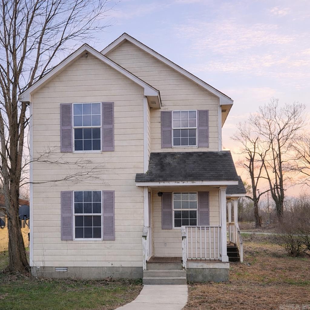 Need another rental? Or bring your toolbox and creative vision and make it your own!  "This cozy 3 BD/1.5 BA two story fun house is full of charm and potential - and it waits for you to refresh it! Conveniently located on the west outskirts of town, walking distance to Walmart, Hays and local fast food, it makes every day errands and meals a breeze. Unique triangular lot with large yard and room for extras.  Whether you're an investor adding to your portfolio or a handy future homeowner, this property is a great opportunity at an affordable price point.  Selling AS IS"