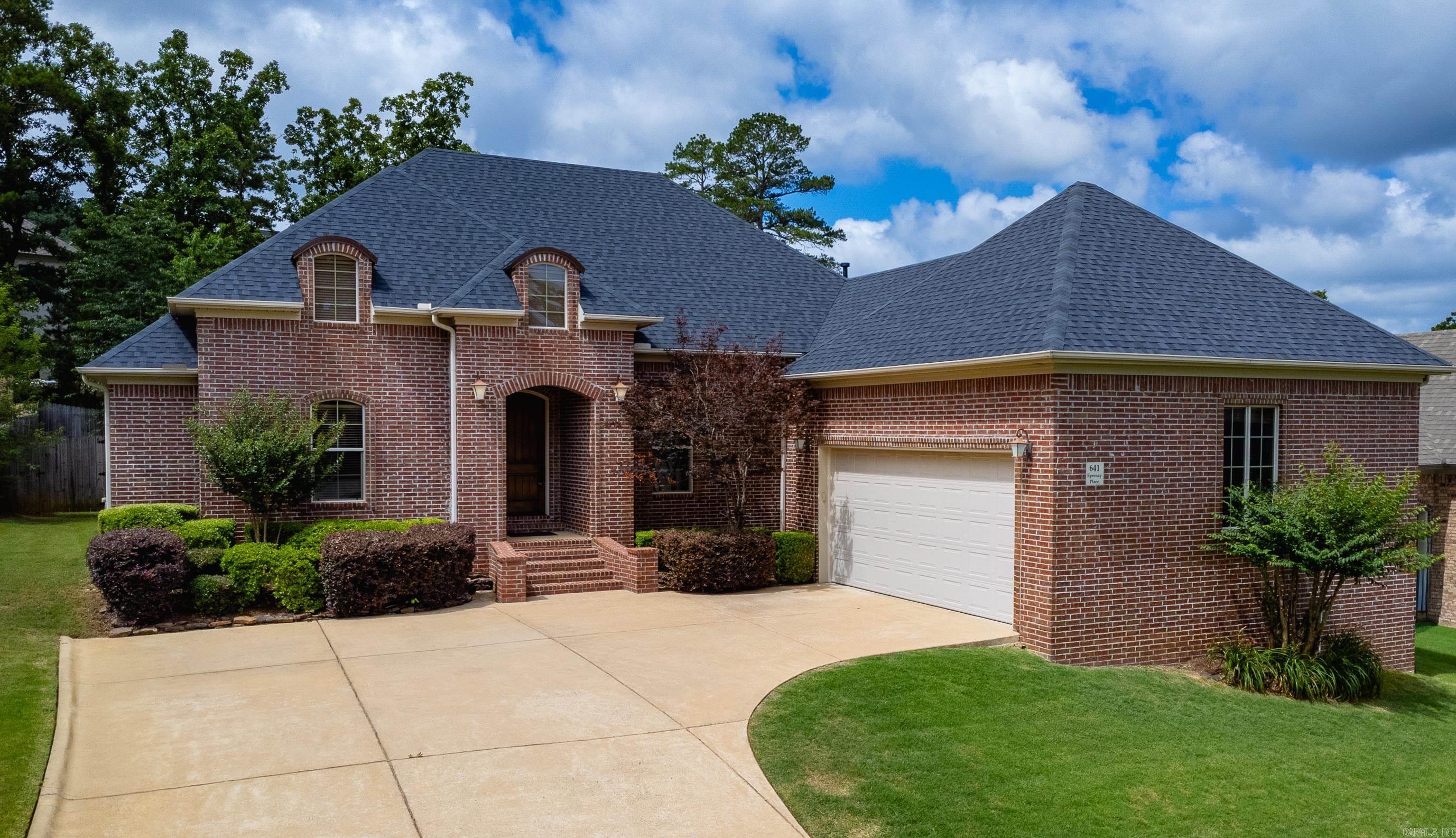 Enjoy the ease of one-level living in this all-brick home in Chenal's Epernay neighborhood. With two spacious living areas, there's plenty of room to gather, entertain, or simply spread out. The formal living room offers additional flexibility, while the den features a gas fireplace and opens to the kitchen, creating a comfortable space for everyday living. The kitchen is equipped with granite countertops, high end appliances, a 5-burner gas range, wine refrigerator, under-cabinet lighting, and abundant cabinet and counter space. A formal dining room is perfect for holiday meals and special occasions.  Hardwood floors flow throughout the main living areas. The private primary suite offers a large walk-in closet, walk-in shower, and relaxing air-jetted soaking tub. A dedicated office with an attached bath can easily serve as a fourth bedroom, guest suite, or flex space to fit your needs. Additional highlights include a laundry room with sink, partially covered patio, new roof, fenced backyard, and mature tree-lined setting. The thoughtful floor plan offers the convenience of single-level living with the space and flexibility to fit a variety of needs. Agents, see remarks.
