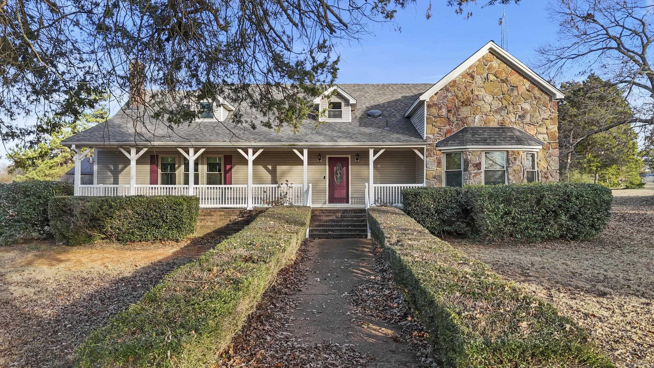 Come check out this large home with endless posibilities in a VERY desirable rural subdivision just minutes from town! Sitting peacefully on a 2.3 acre corner lot, this home features two levels with the primary suite on the ground floor with an updated bathroom & built-in shaker-style cabinets for extra storage & two walk-in closets. The spacious family room features a large rock wood-burning fireplace with newer wood laminate floors. The kitchen contains loads of custom solid oak cabinets, granite countertops, & a double wall oven! There is another large bedroom with an office space downstairs & a 3/4 bath located nearby. Located at the top of the steps is a study/2nd living space, and you'll find a large bedroom that could also be used as a bonus room. The other bedroom has a room off of it with closets and a window, but can only be accessed through that bedroom. The unfinished basement houses the water heater & some of the plumbing is accessible here as well...PLUS this can be a great place for storage. Outside you'll find a detached 2-car garage w/ covered path to home, a great garden spot, storage building & a charming front porch. There is a lot of potential in this home!
