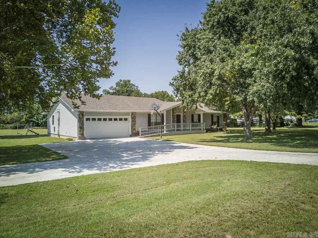 Great location in a quiet country subdivision. Be sure and check out the virtual tour!  New roof in 2016. Huge room at the back of the house that could be a 4th bedroom or a family room, complete with a full bath and closet area. Nice covered back porch. New storm shelter that can comfortable hold the whole family and friends. There is a room off the kitchen that could be an office or craft room. New laminate flooring when you enter.Lots of concrete for parking. Two sided fireplace with 2 sets of gas logs.
