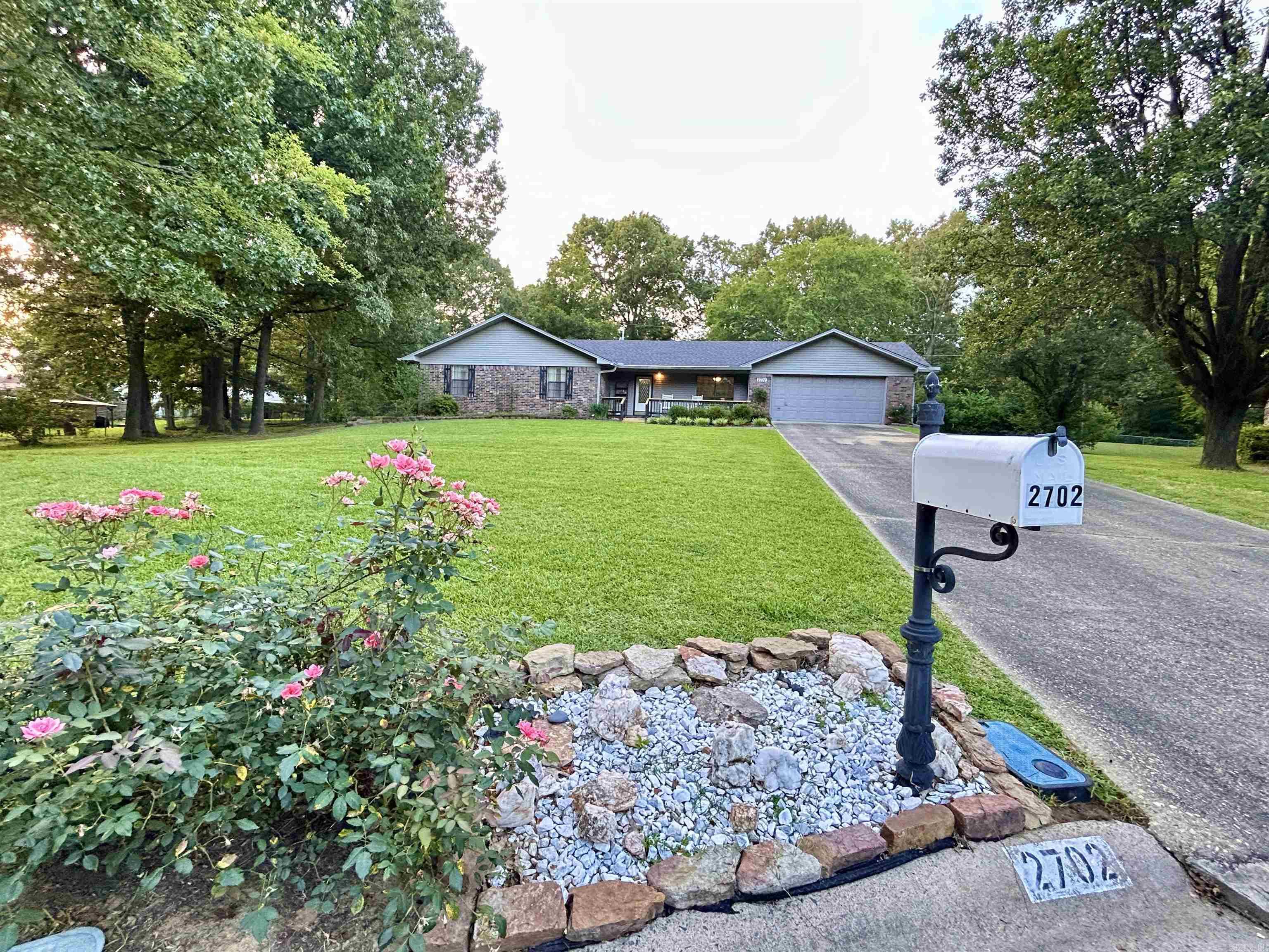 This all brick home in Rolling Brook is a special place - sitting at the back of a cul-de-sac on almost a half acre adorned with beautiful trees and landscaping.   This well maintained and clean home features over 1900 sq ft of comfort.   The large living area has a vaulted ceiling and plenty of options for furniture arrangement, and leads to a sunroom overlooking the backyard.  The sunroom would make a great den/craft room/bonus room.   In 2025 the kitchen/dining area was upgraded with fresh painted cabinets, backsplash, new counter tops and new induction cooktop with combination oven/air fryer.   All bedrooms are nice size and have walk-ins closets.   The primary bedroom features two closets and a handicap accessible walk-in shower.   The entire home interior was recently painted.  The hvac and roof were replaced in 2020.   The refrigerator, washer and dryer convey.  The backyard features a storage building and French drains.   Make your appointment today!   see agent remarks.