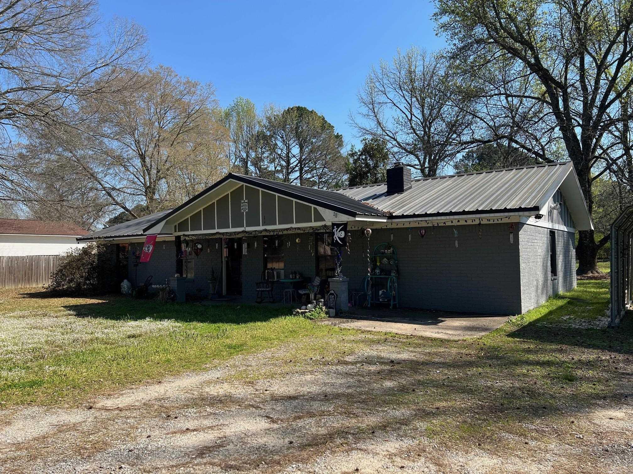 Four Bedroom Brick Home with Two Full Bathroom. Wood Burning Fireplace 30x40 Detached shop.  30x30 three bay carport