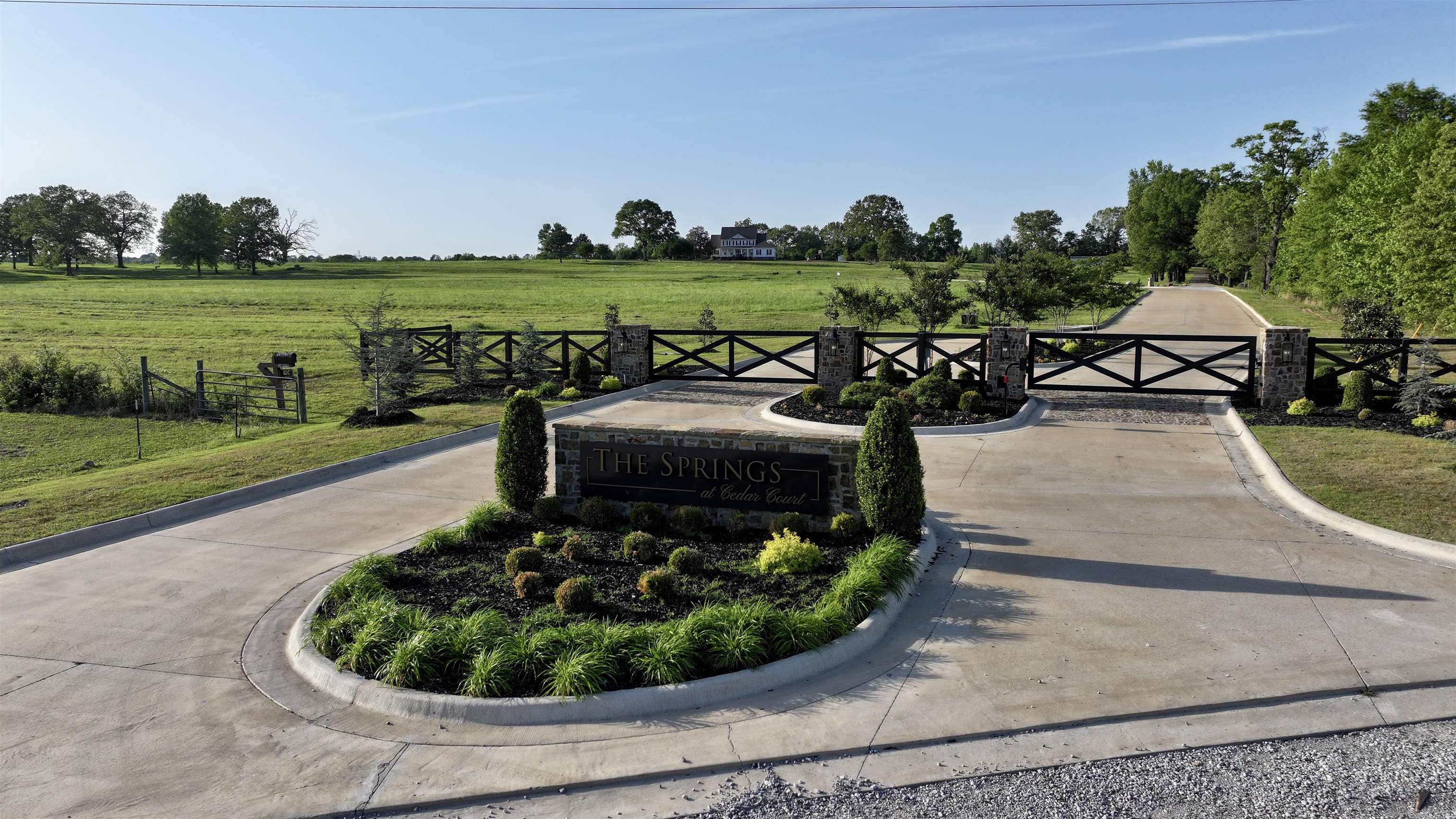 Discover The Springs at Cedar Court, Searcy’s newest premier luxury subdivision in White County, Arkansas. This exclusive 80-acre gated community offers 22 spacious residential lots ranging from 3 to 5 acres each, plus an existing 3,983 sq ft modern farmhouse on over 10 acres. Nestled just a quick 7-minute drive south of downtown Searcy, the development features beautifully landscaped entrances with stone pillars, concrete streets, underground utilities (including high-speed fiber internet and natural gas), and serene countryside views. Some lots include private ponds, and the community allows up to two horses per lot. With protective covenants requiring a minimum of 2,800 square feet of heated and cooled living space, The Springs at Cedar Court is perfect for custom-built dream homes that blend luxury with privacy. Enjoy rolling fields, stunning sunsets, and peaceful rural living while remaining close to all the amenities of one of Arkansas’ fastest-growing cities. Searcy has been recognized by the U.S. Census Bureau as one of the top growing cities in the state, with a thriving economy, excellent schools, a vibrant downtown, hospital, airport, and easy access to US-67.