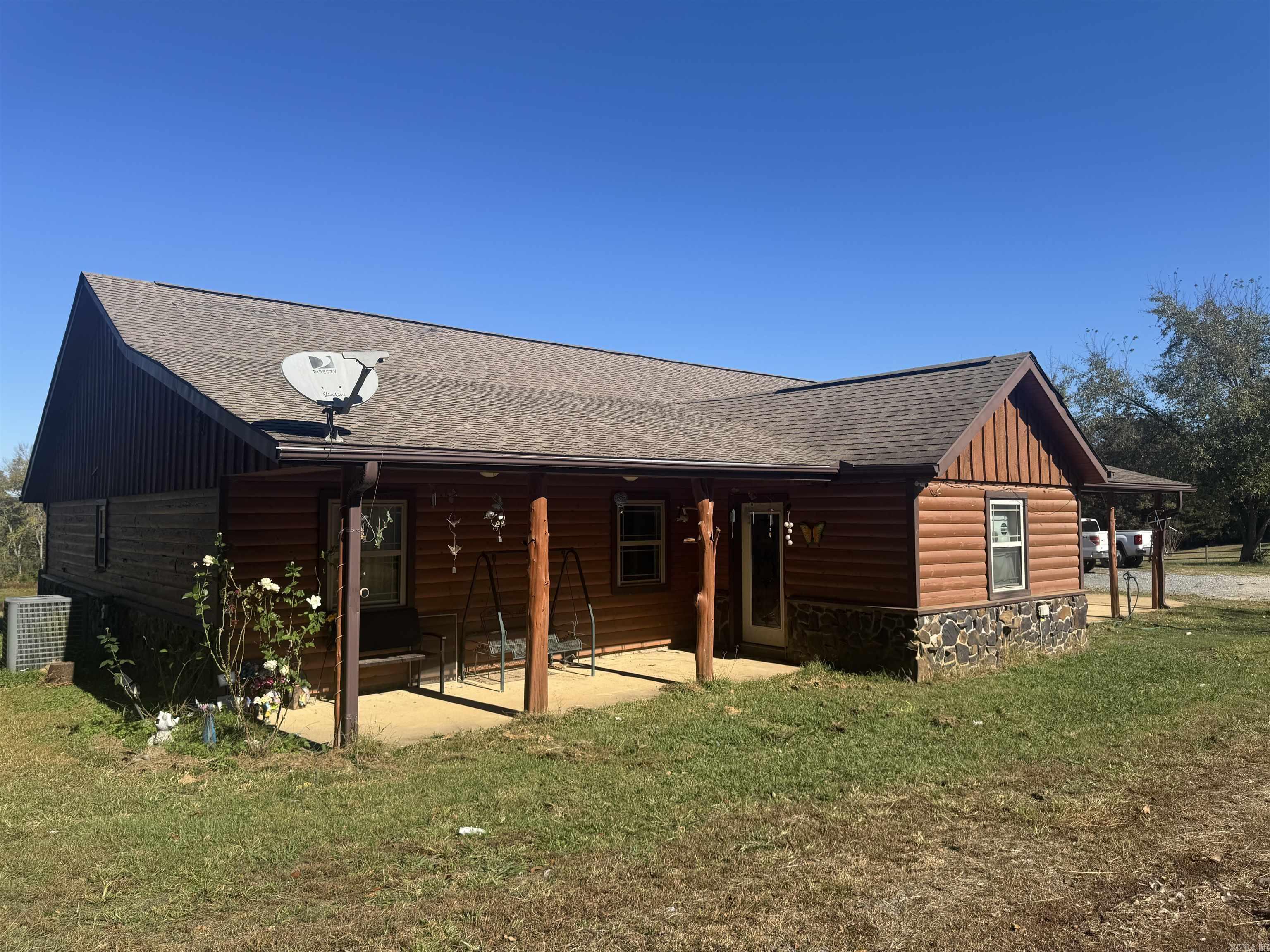 This 4-bedroom, 2-bath home in Cove, Arkansas, offers comfort and country charm on a beautiful property with both open and wooded areas. The home sits on a mostly cleared front yard and features a small pond, a mature fruit tree producing plums, pears, and peaches, plus a chicken coop for those who enjoy hobby farming. A 40x30 concrete slab includes a 30x30 shop with two garage doors—perfect for storage, projects, or a workspace. The property also has a well house that can be used for extra storage and a large carport that fits an RV, complete with an RV hookup nearby. The master closet doubles as a tornado shelter, providing added peace of mind. The wooded section of the property lies across the legal easement (Hendricks Lane), offering privacy and natural beauty. Conveniently located just minutes from ATV trails that lead to Wolf Pen Gap, this home combines functionality, outdoor enjoyment, and rural appeal.