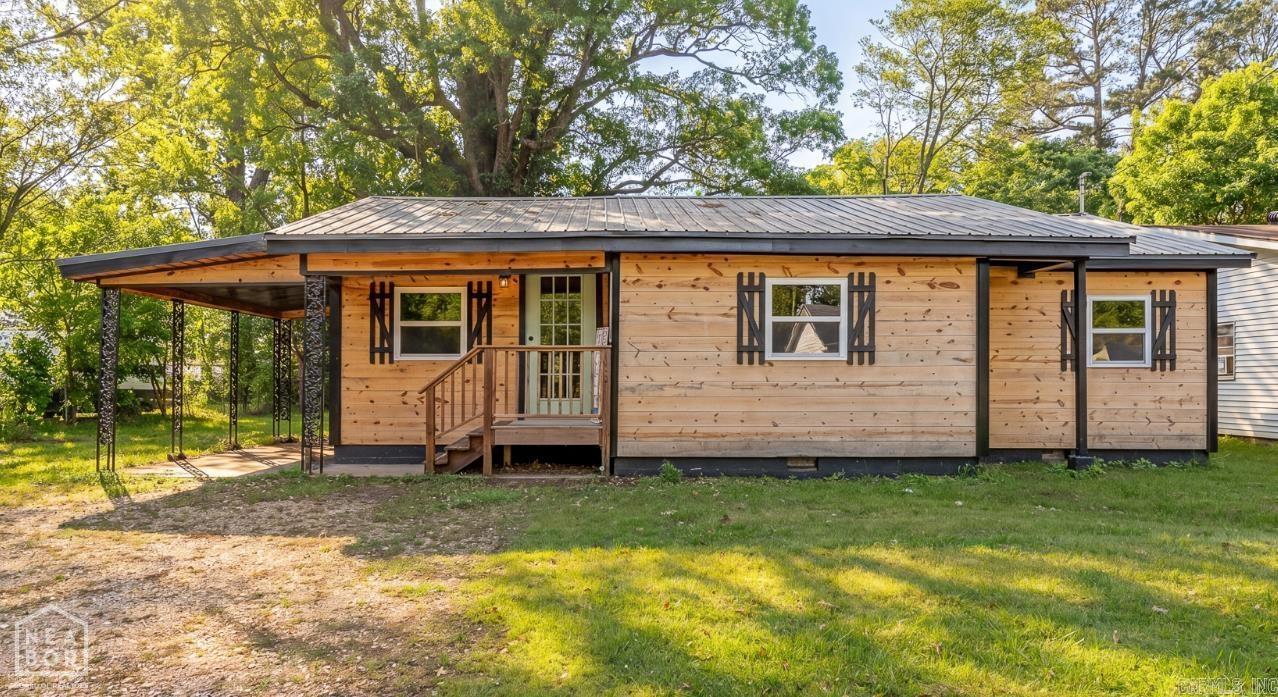 Who would have thought that you could get a house as cute and level of quality as this one for this price? Everything about this house is new except the ground it sits on. Even the studs and floor joists are new. The current owner has taken great care to make sure that every aspect of this house was done well: Stainless upgraded kitchen appliances, black farm house sink, laminate flooring, new carpet in the bedrooms, new kitchen cabinets, etc. Every system is new including electrical, plumbing, heat and air, and metal roof. This one may be small but it is mighty with quality upgrades. The back yard is spacious with shade trees and is fenced on 3 sides. Storms will no longer be as scary with the inground storm shelter. You really have to see it to appreciate how much love the owner has put into it. Can you imagine how inexpensive the utility bills would be? To find anything worth living in at this price is a needle in a haystack but this one is so much more. Come see for yourself.
