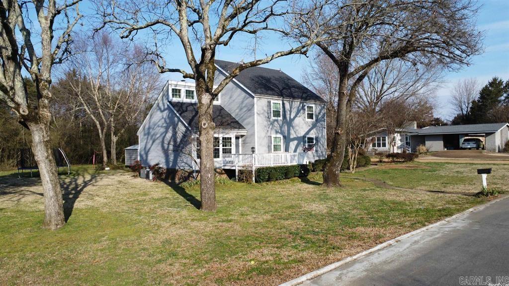 Wonderful 3-bedroom home on a quiet street near Sandy Beach on Greers Ferry Lake.  The primary bedroom suite is conveniently located on the main floor with an adjacent laundry room.  There are two additional bedrooms and a bathroom upstairs.  There's even a bonus room on the third level! This home is complete with a two car garage and spacious basement storage area.  The property also comes with a charming Gazebo in the side yard; perfect for enjoying the beautiful Arkansas weather.  Contact me today for a showing.