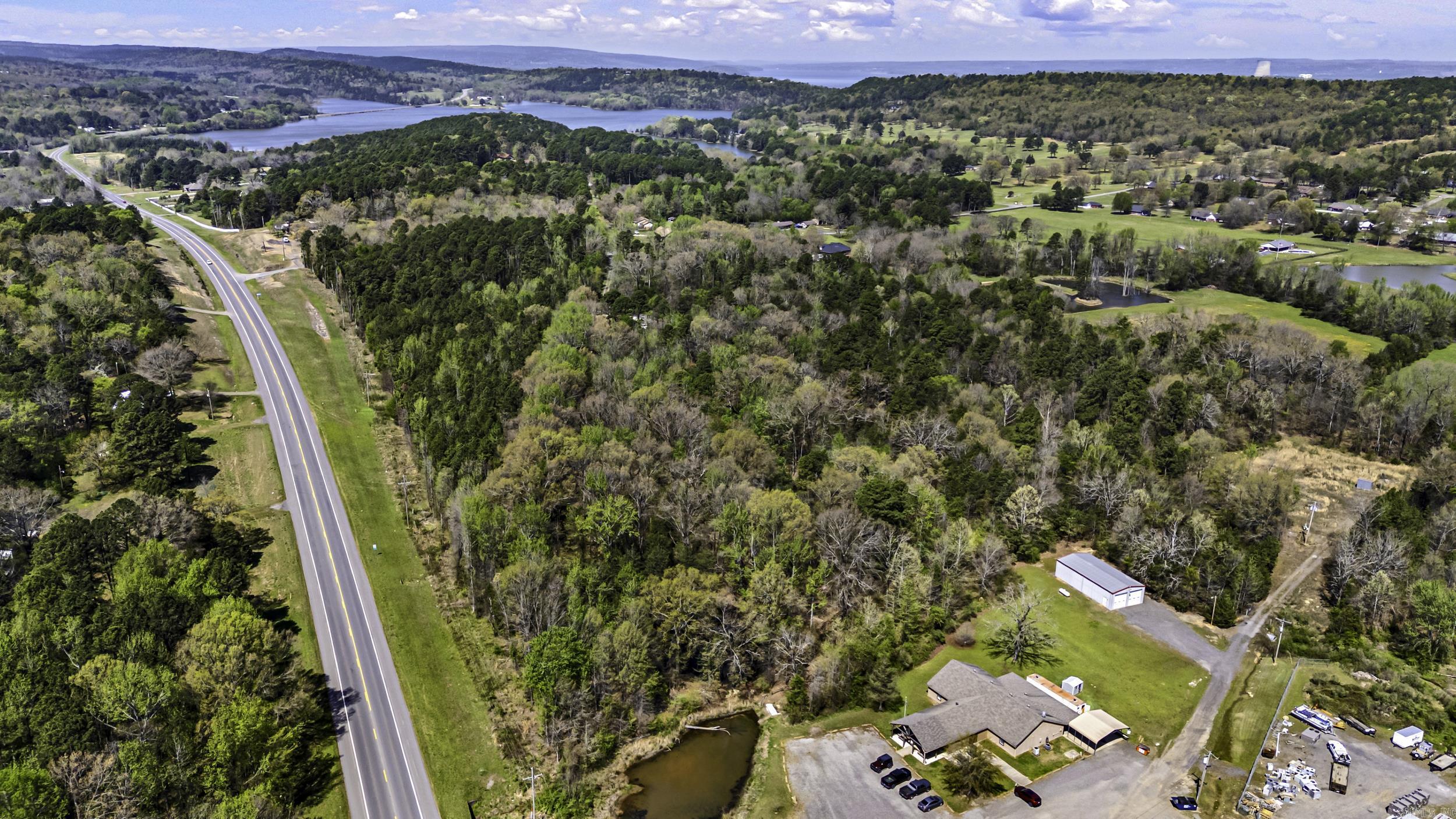 32 +/- acres located at the highly visible corner of Bay Ridge Road and Highway 22 in Dardanelle, Arkansas. This prime tract offers 1,357 feet of Highway 22 frontage, providing excellent visibility and easy access for commercial, residential, or mixed-use development. Electric and water are available at the road, and the property has no restrictions, allowing flexibility for a wide range of uses. Positioned in a growing area near Lyon’s Den Golf Course and just minutes from Lake Dardanelle camping areas and boat launch, this location benefits from steady local and recreational traffic. The corner location and strong highway presence make this property ideal for investors or developers looking to capitalize on growth in this desirable corridor. A rare opportunity to secure acreage with utilities, frontage, and development potential in a strategic location.